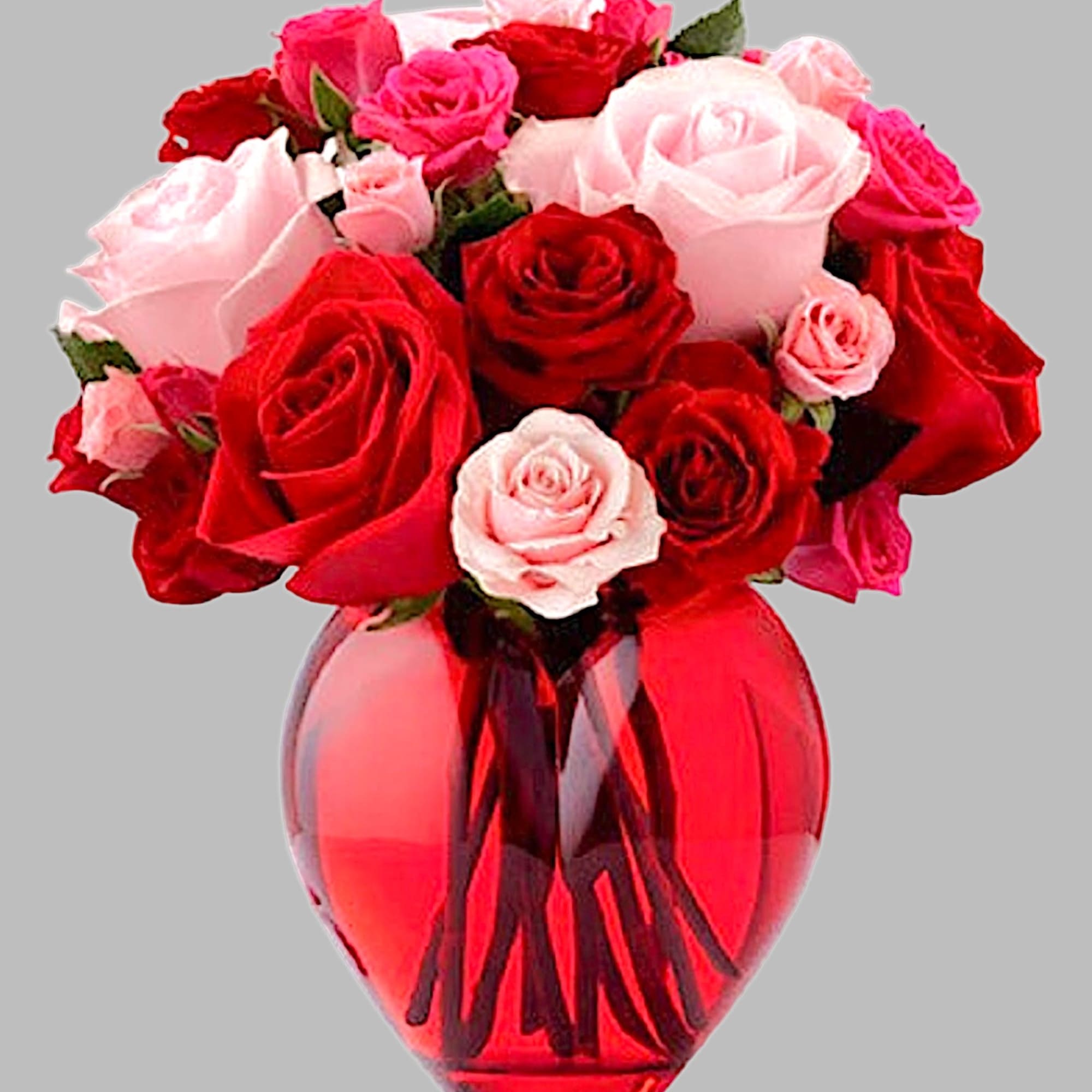 Red and pink roses arranged in a red glass vase, photo 5 of 5