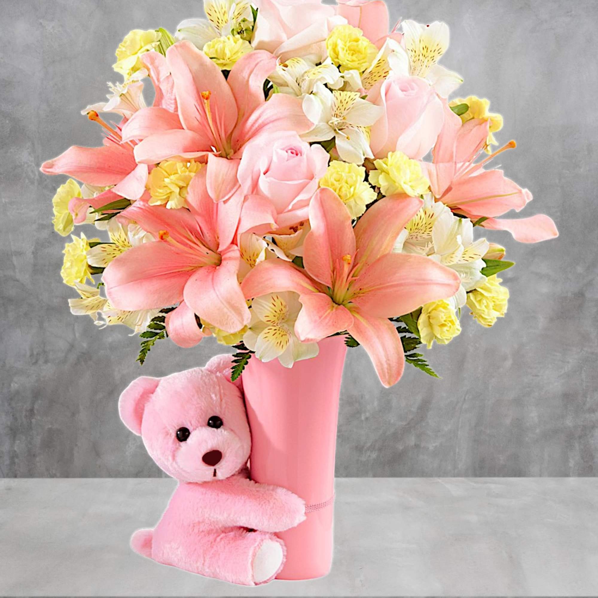 Pink and yellow flower arrangement in a pink vase with a teddy bear, photo 3 of 5