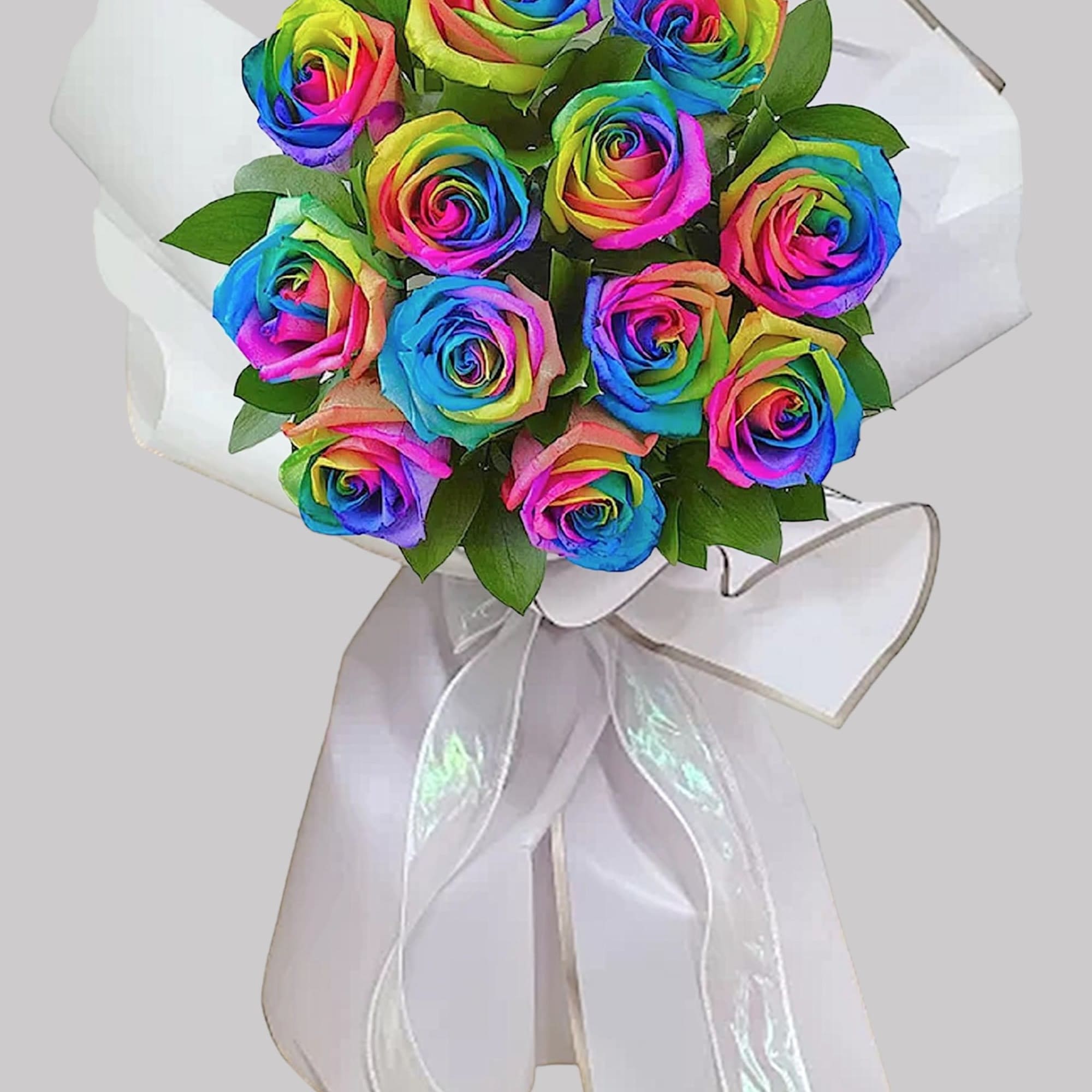 Bouquet of rainbow-colored roses with a white ribbon wrap