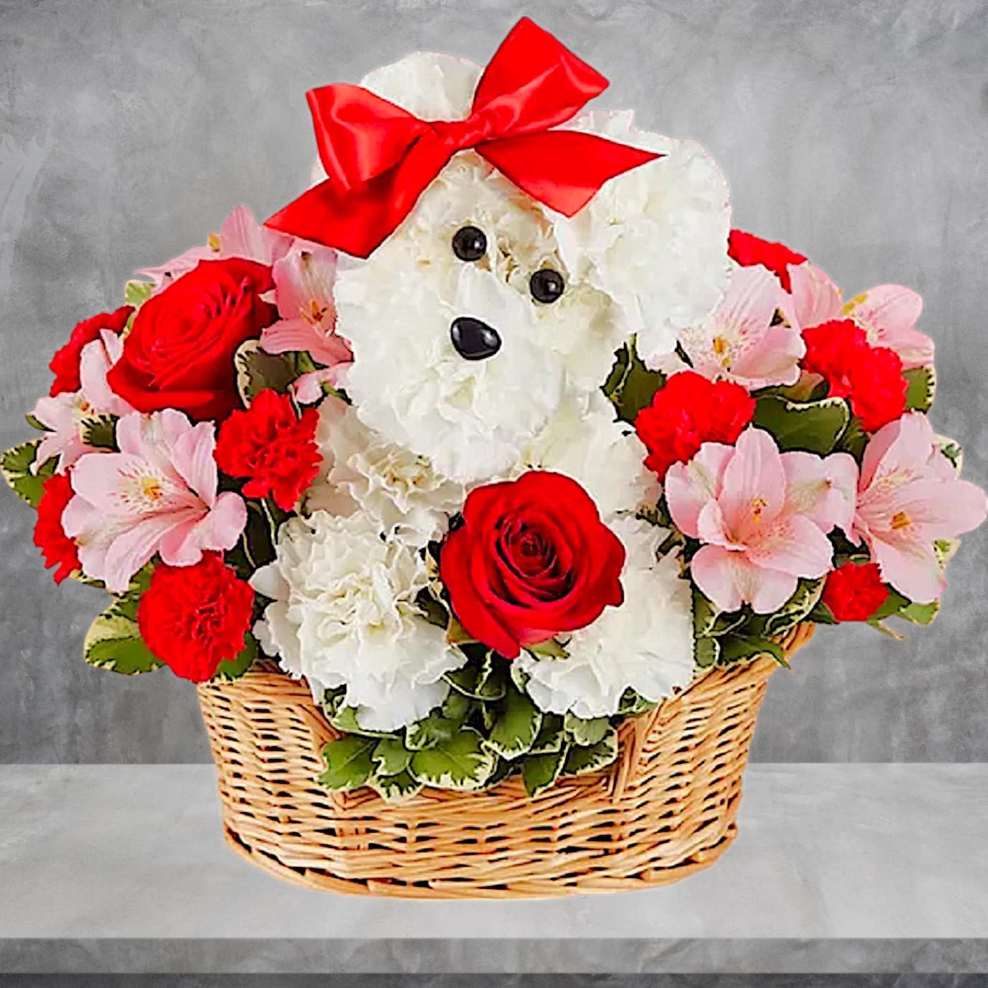 Teddy bear made of white flowers in a basket with red roses and pink blooms
