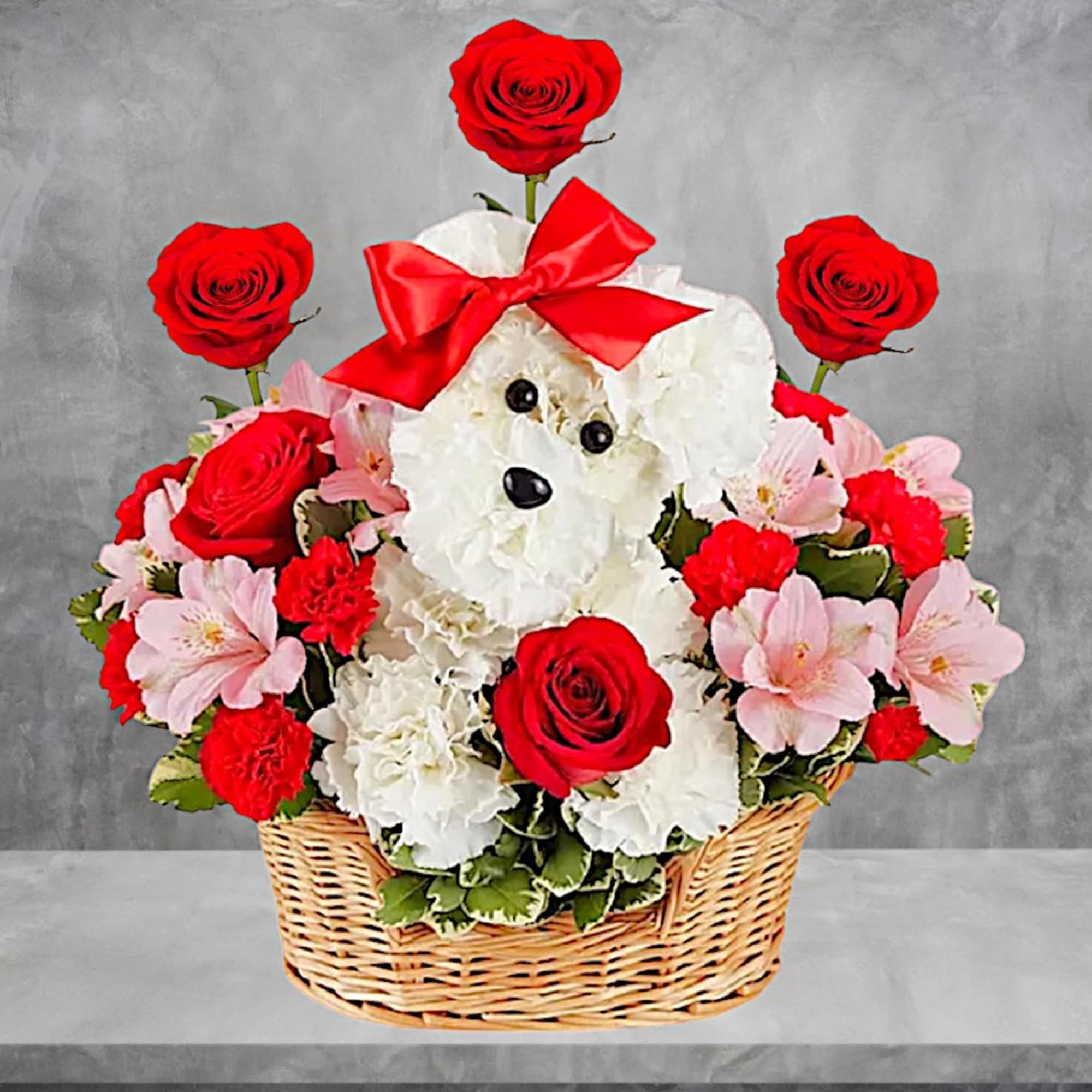 White teddy bear in a basket surrounded by red roses and pink flowers, photo 4 of 9