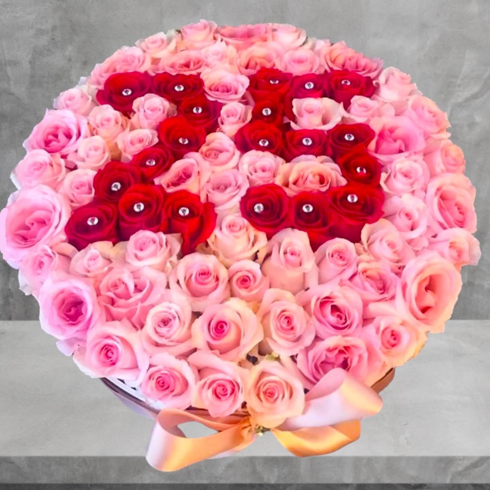 A modern flower arrangement in a Cylinder box filled with roses. Perfect, photo 4 of 8