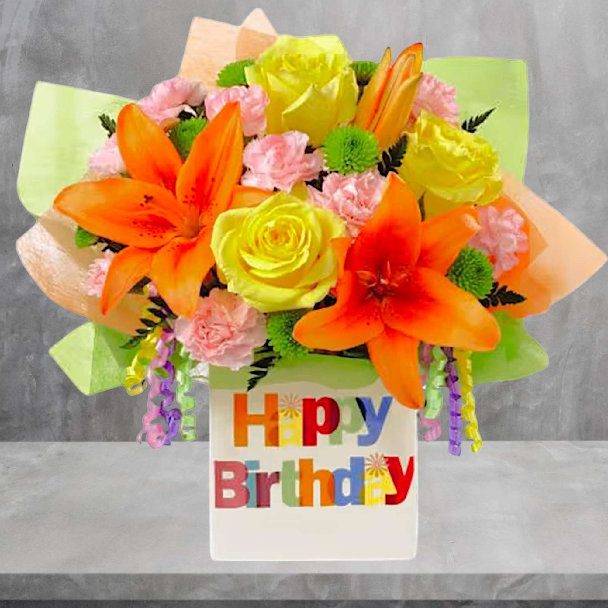 Bright bouquet of orange lilies, yellow roses, and pink carnations in a birthday vase, photo 3 of 5