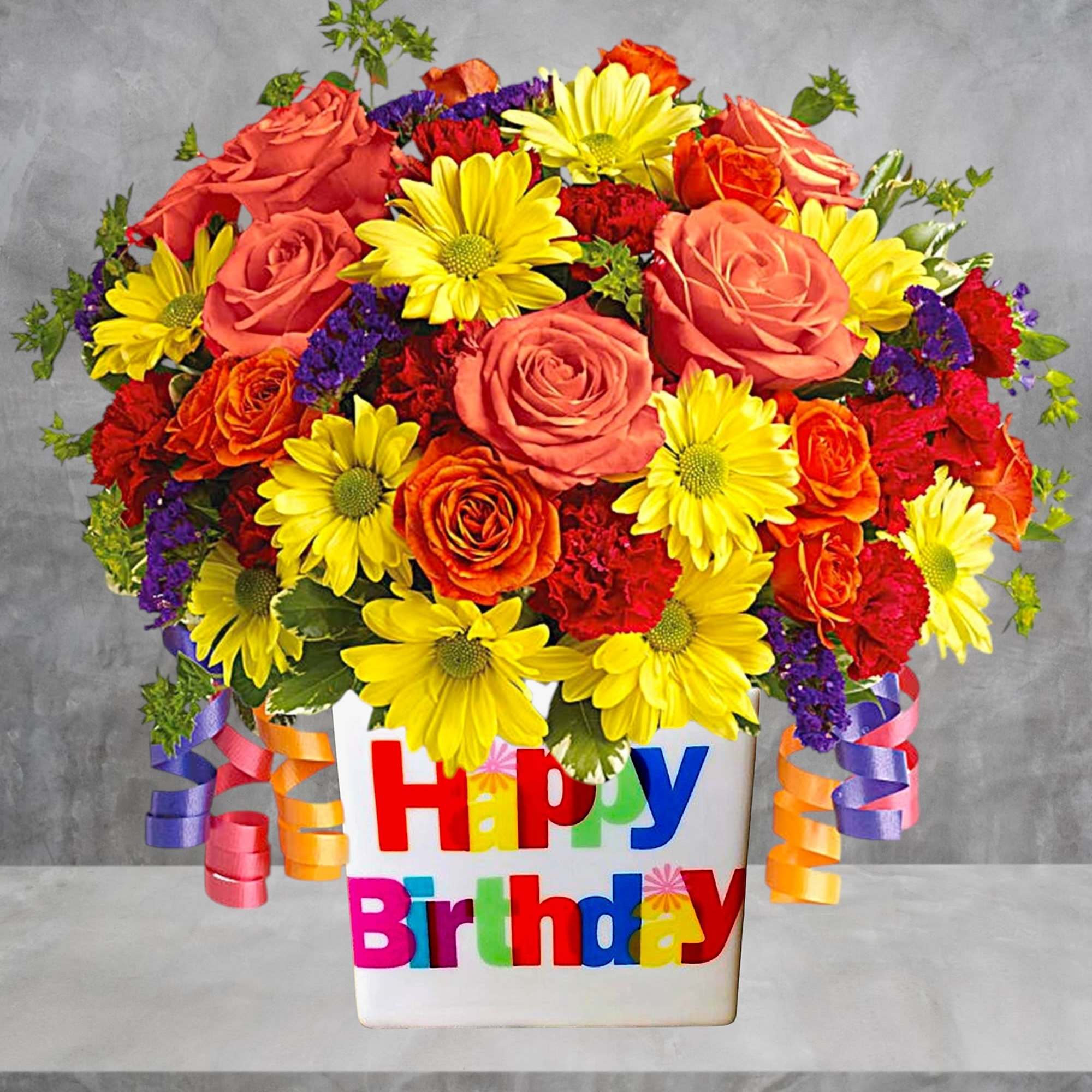 Bright mixed bouquet in a white Happy Birthday container
