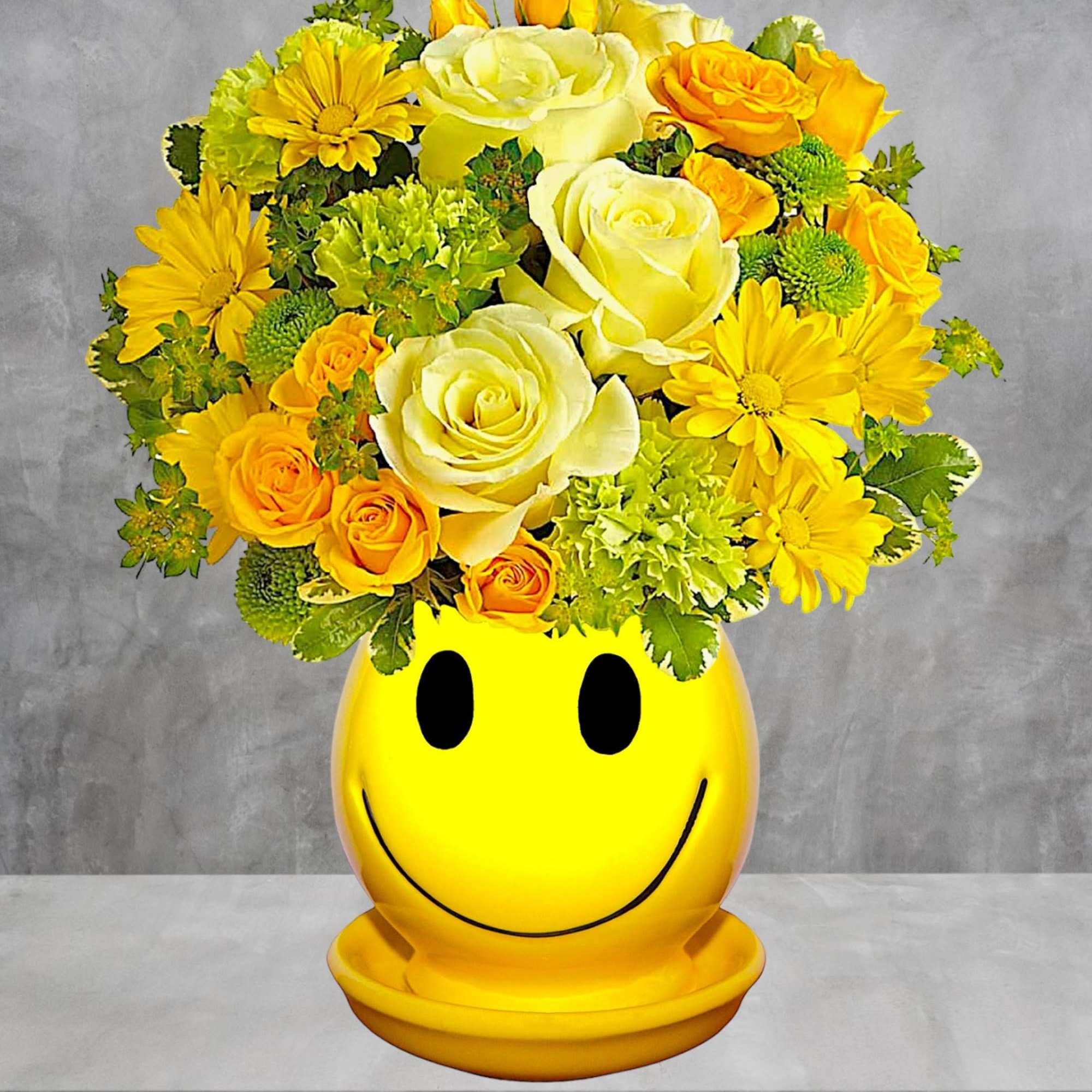Yellow and white flower arrangement in a smiley-face vase, photo 2 of 4