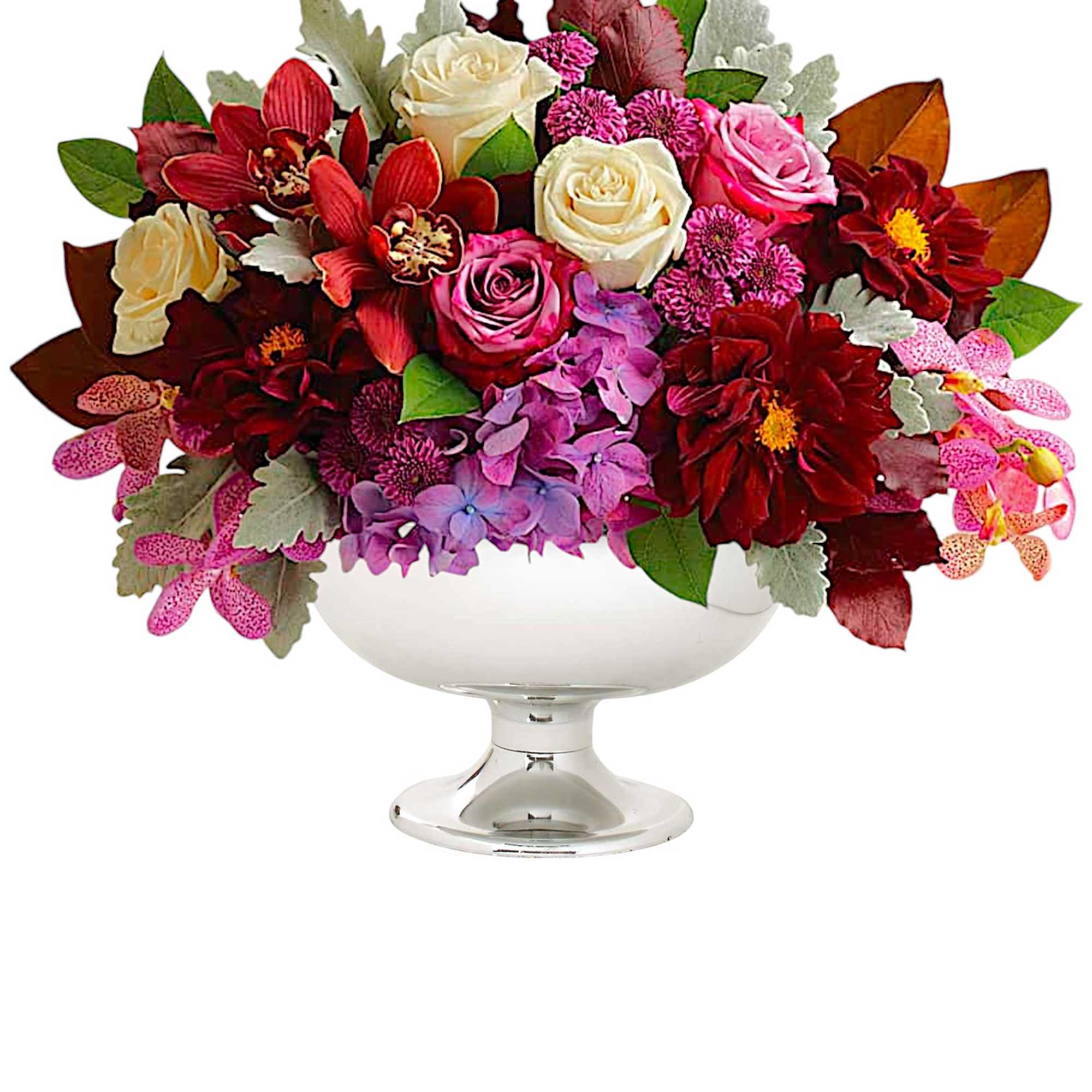 Mixed bouquet of roses and orchids in a white pedestal bowl