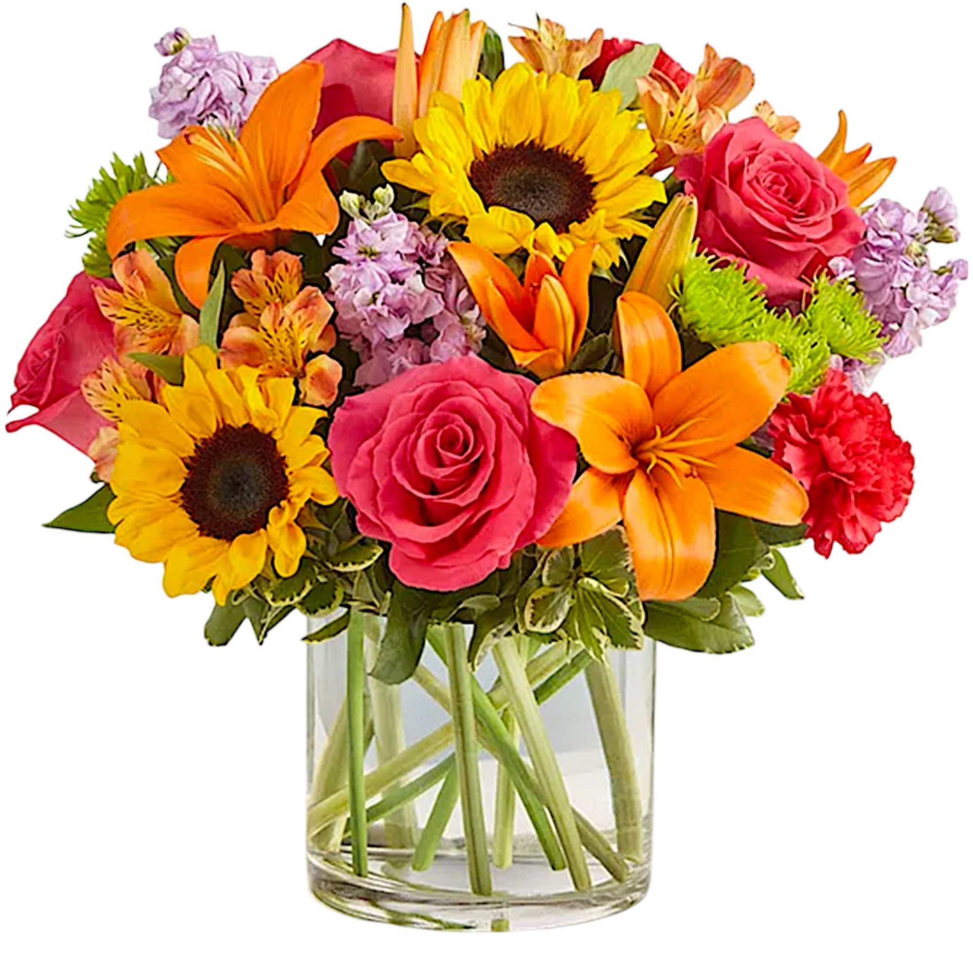 Mixed bouquet of sunflowers, roses, lilies, and carnations in a glass vase
