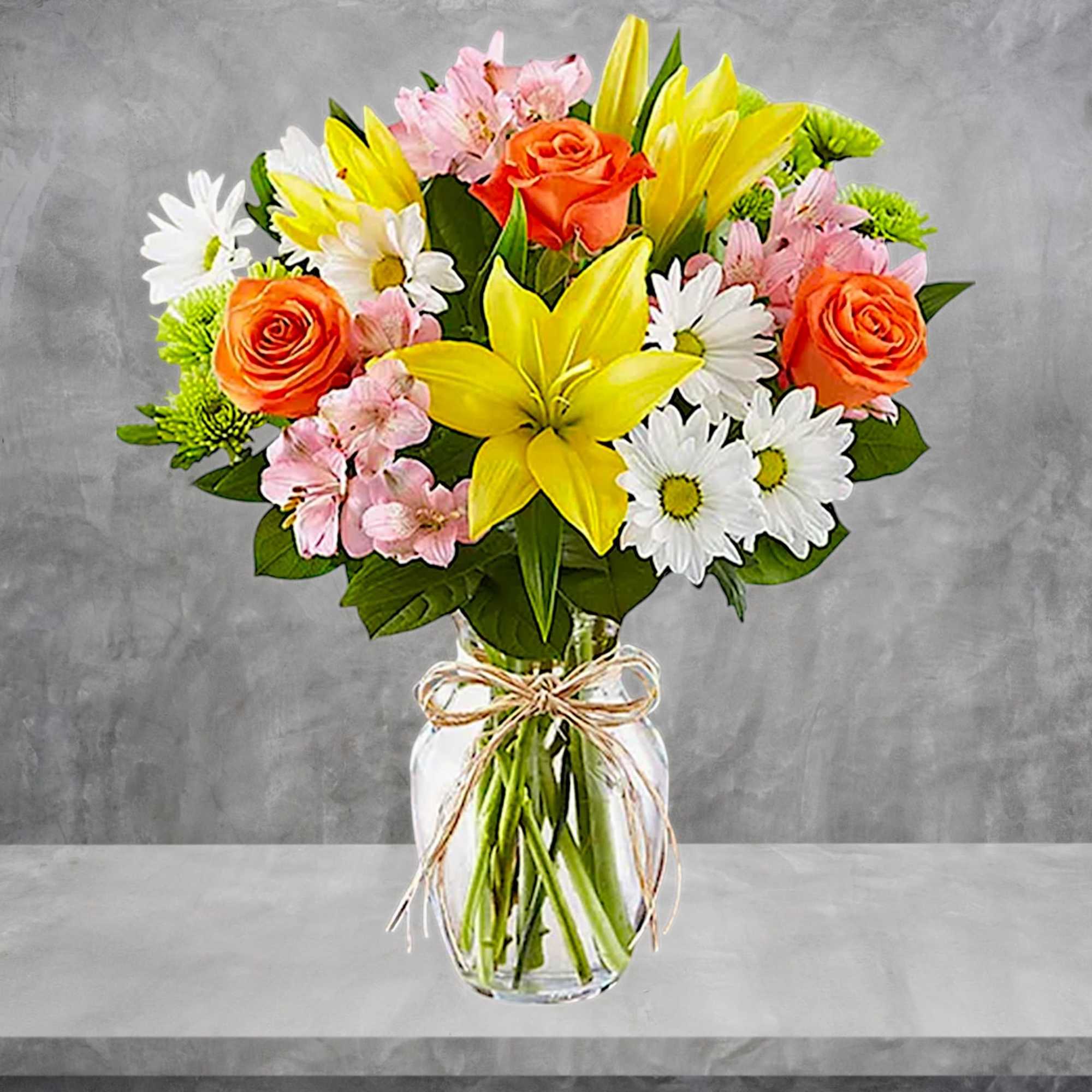 Bouquet of yellow lilies, orange roses, and white daisies in a glass vase, photo 3 of 5