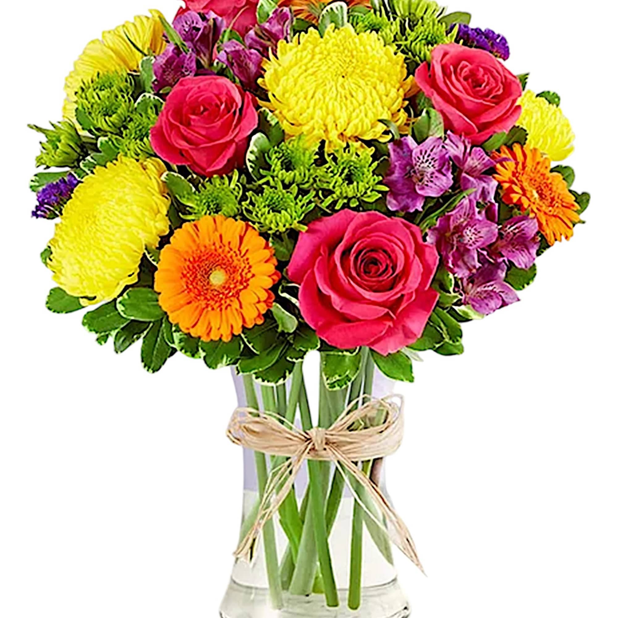 Mixed bouquet of roses, chrysanthemums, gerbera daisies, and alstroemeria in a glass vase