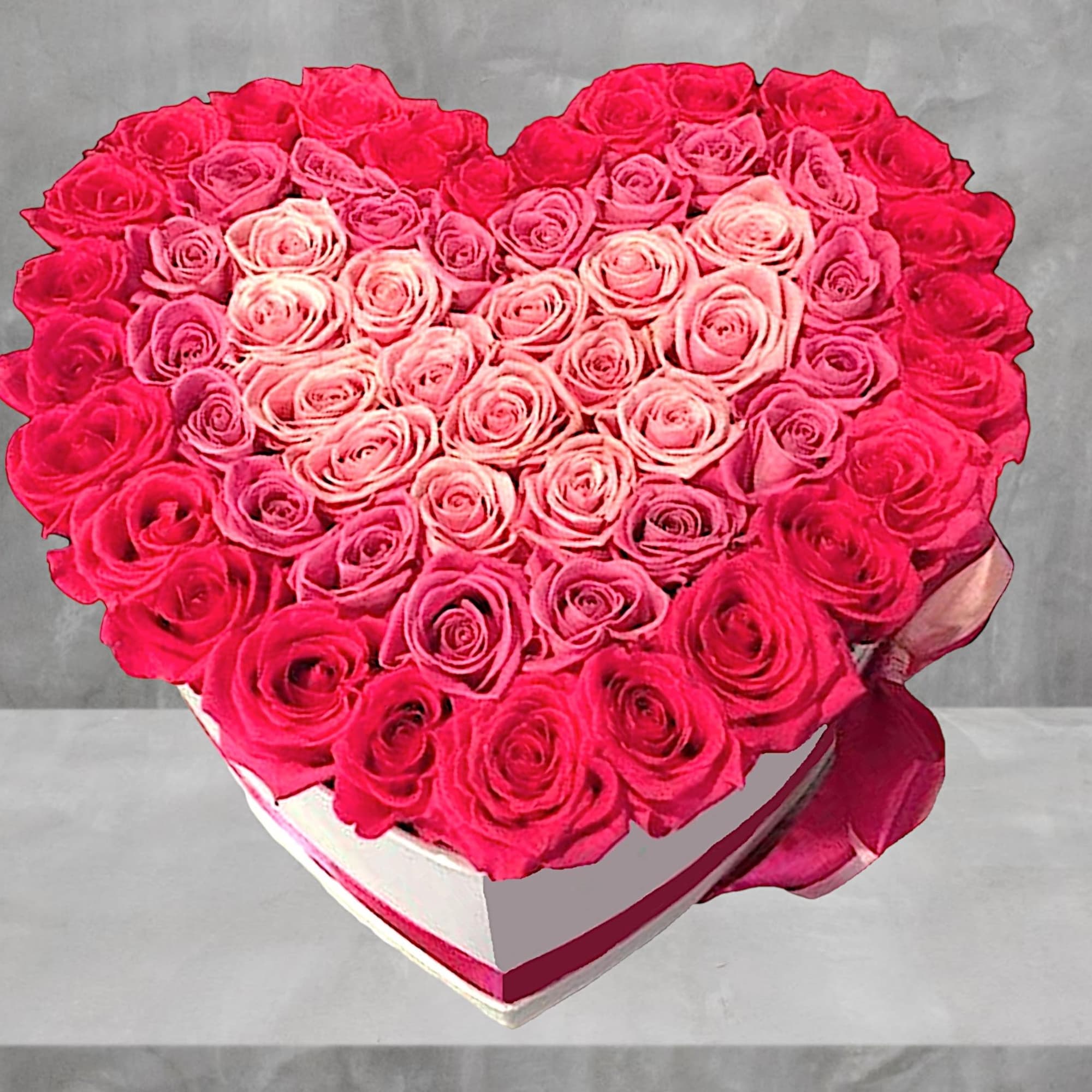 Heart-shaped box filled with pink roses