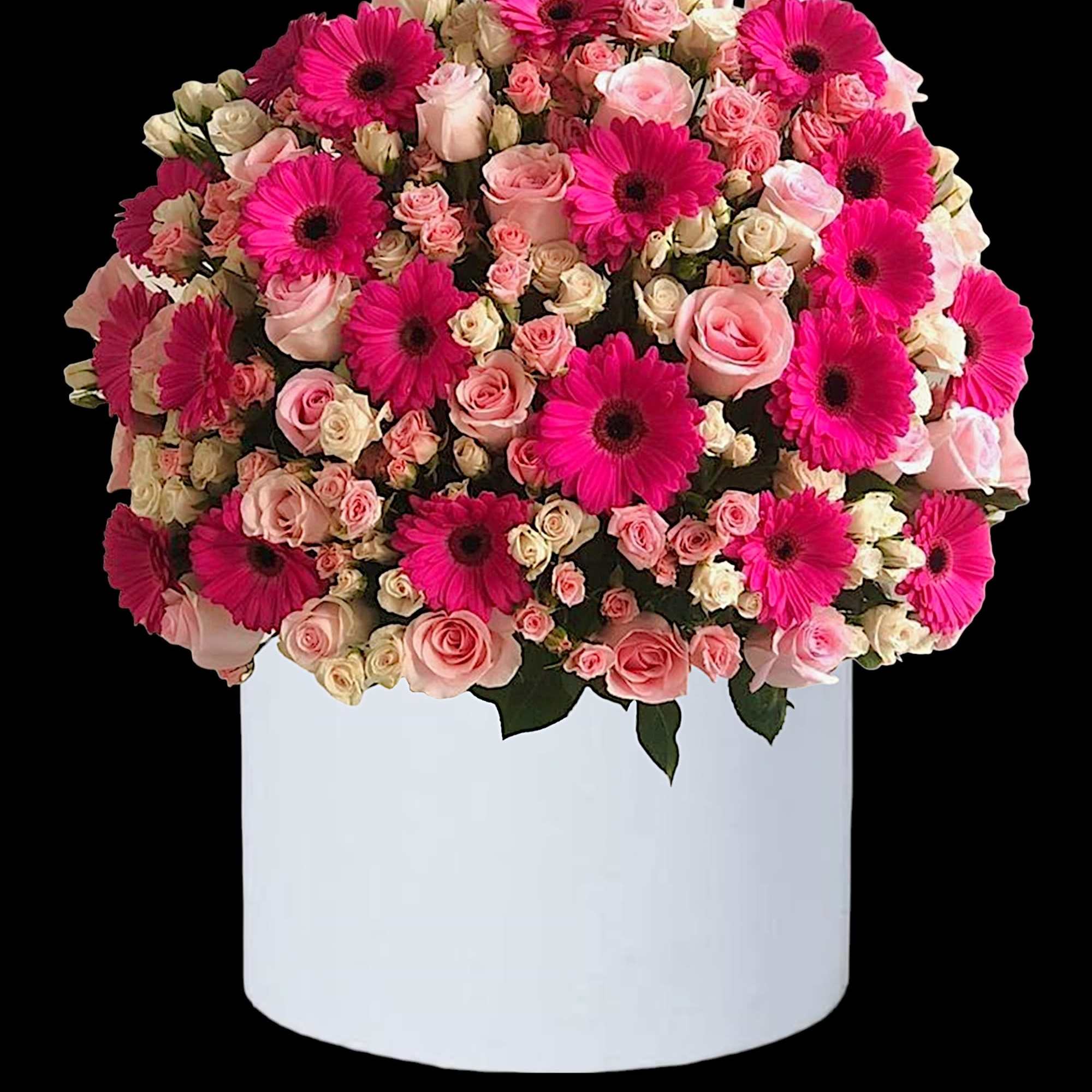 Pink gerberas and roses arranged in a white box