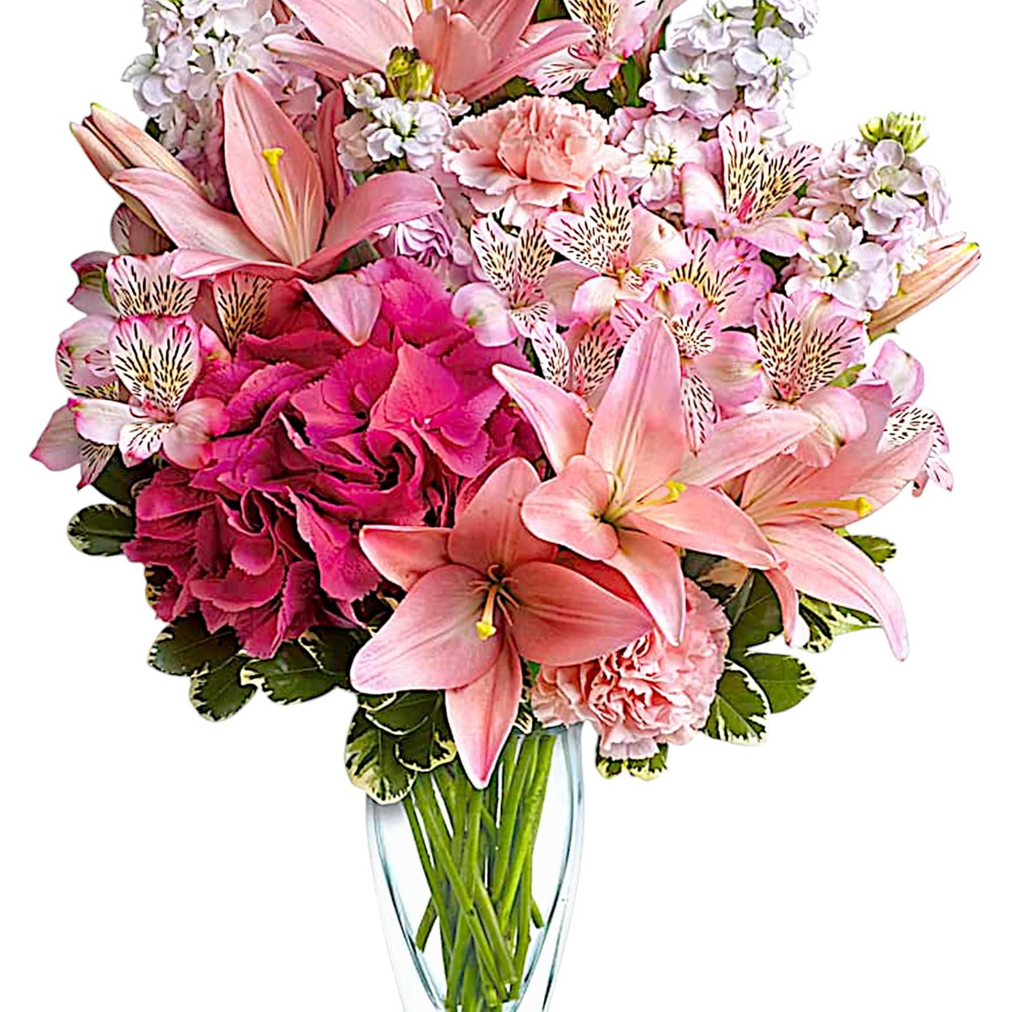 Pink lilies and carnations in a clear glass vase