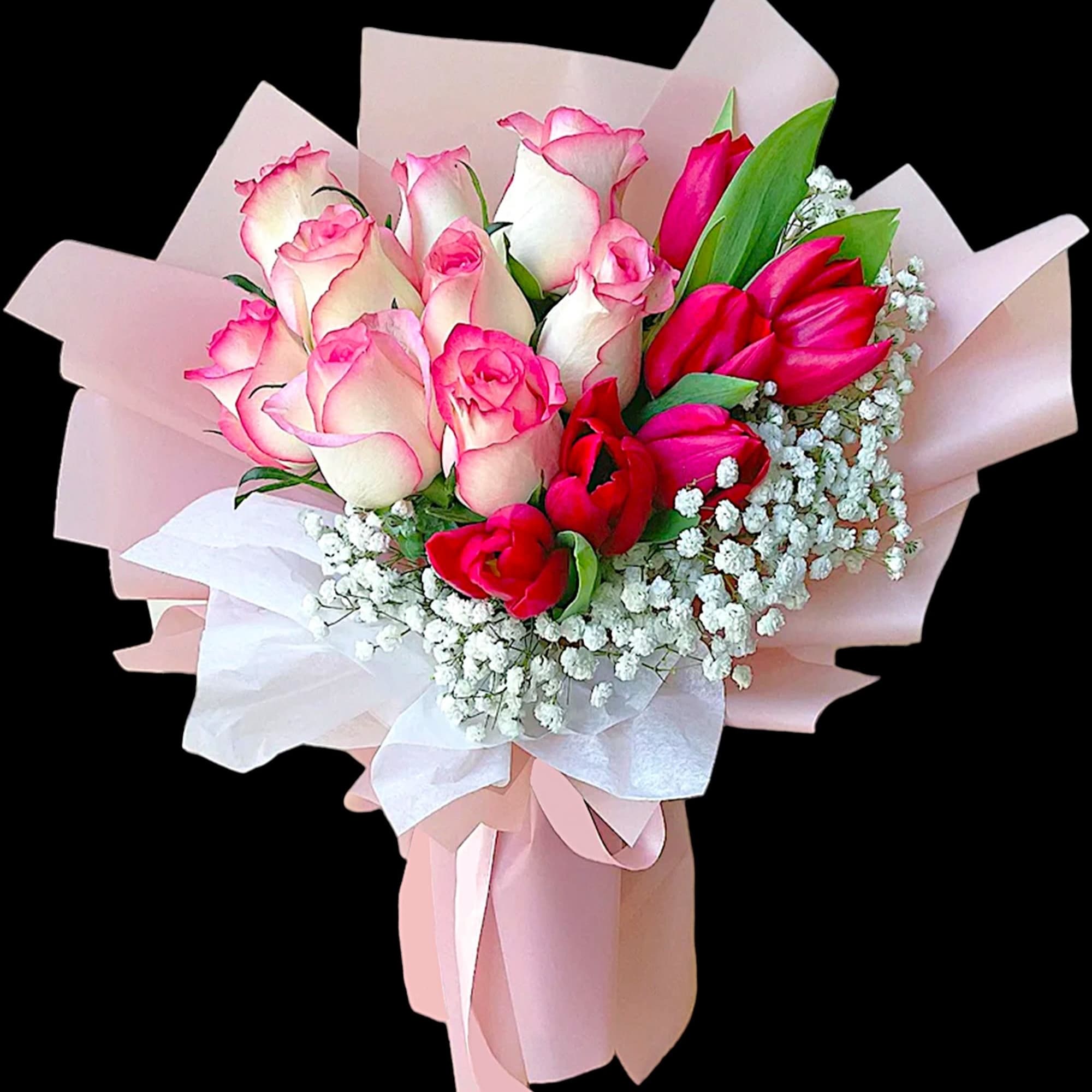 Bouquet of pink and white roses with baby's breath in pink wrapping