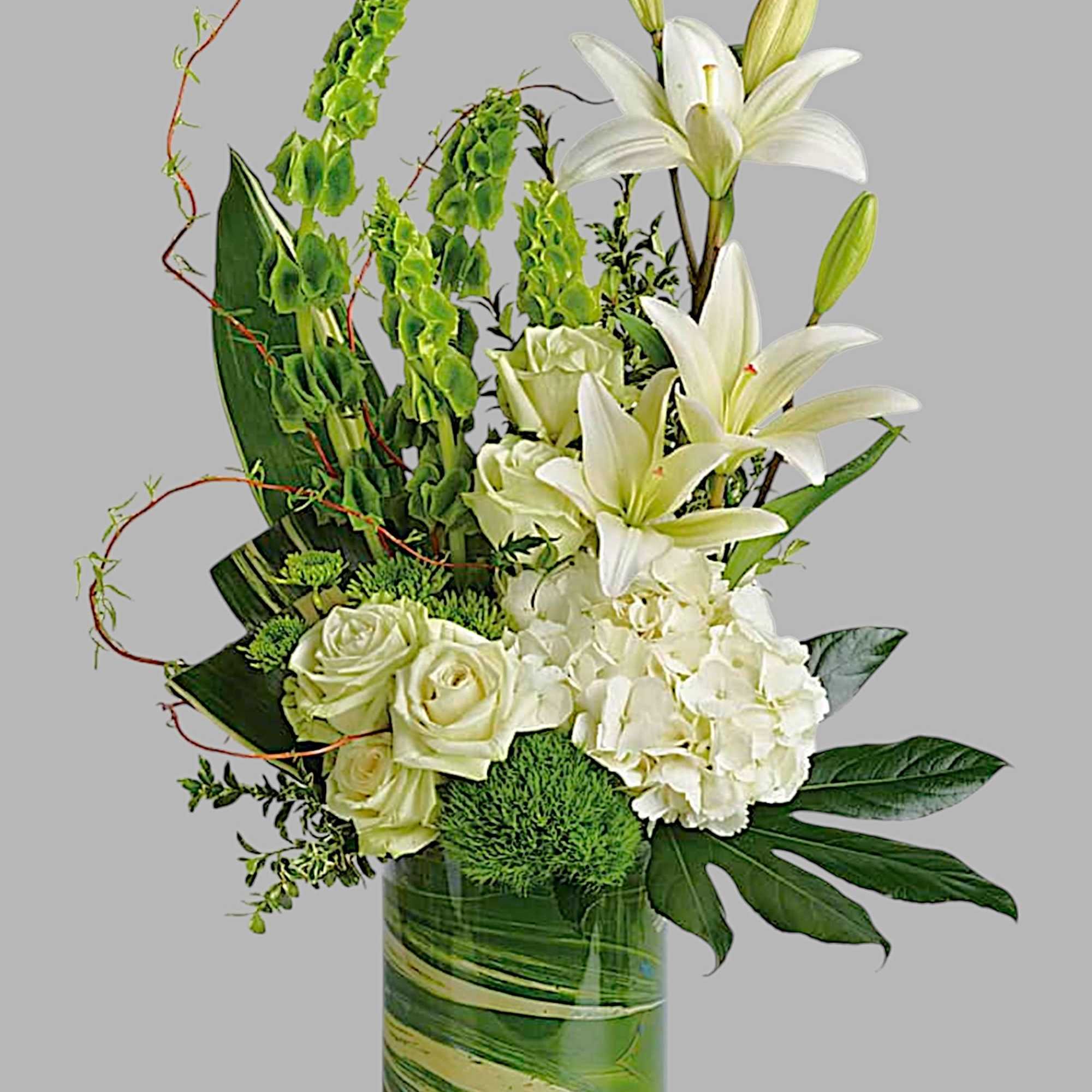 White lilies and roses arranged in a green glass vase, photo 4 of 4