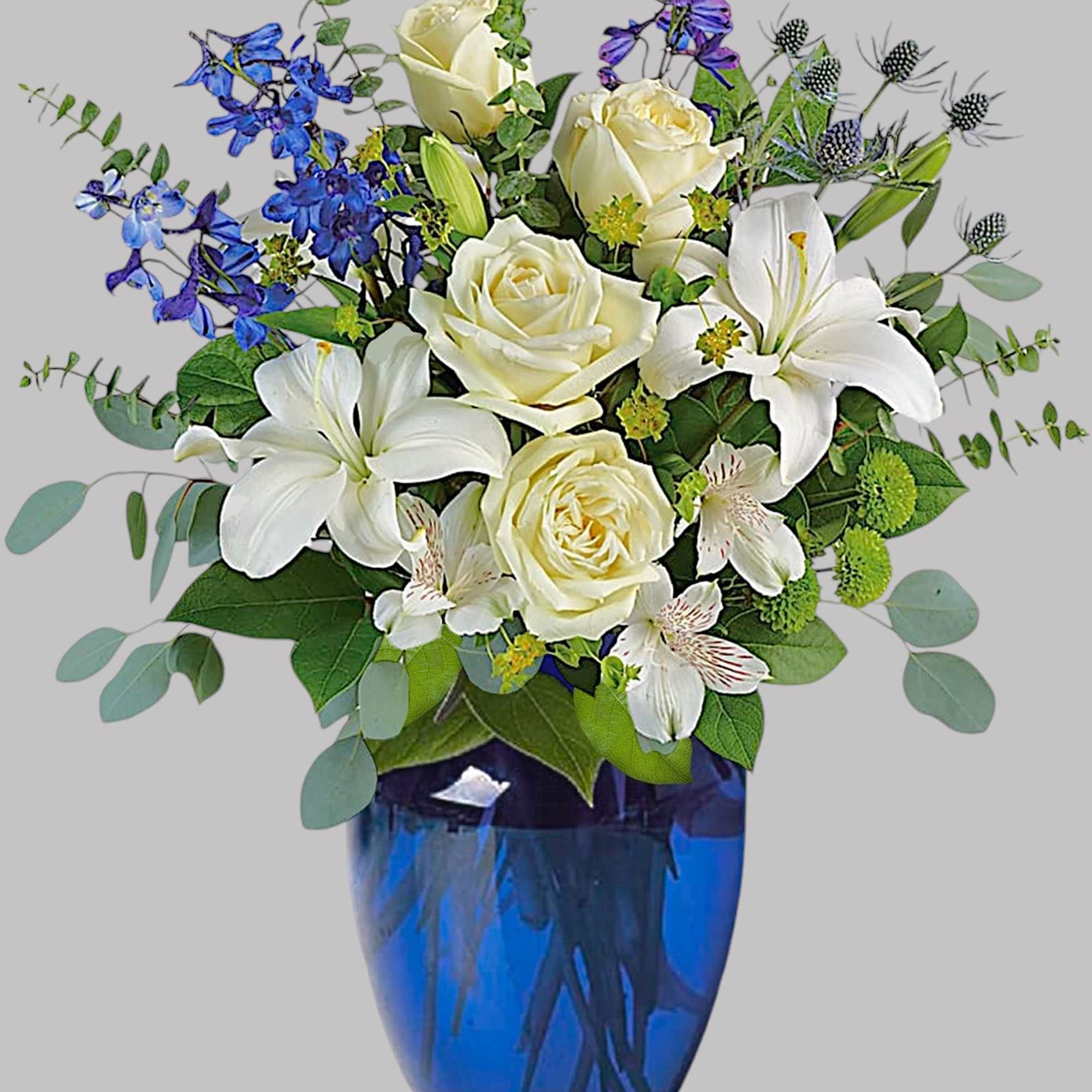White roses and lilies in a blue glass vase with blue flowers, photo 4 of 4