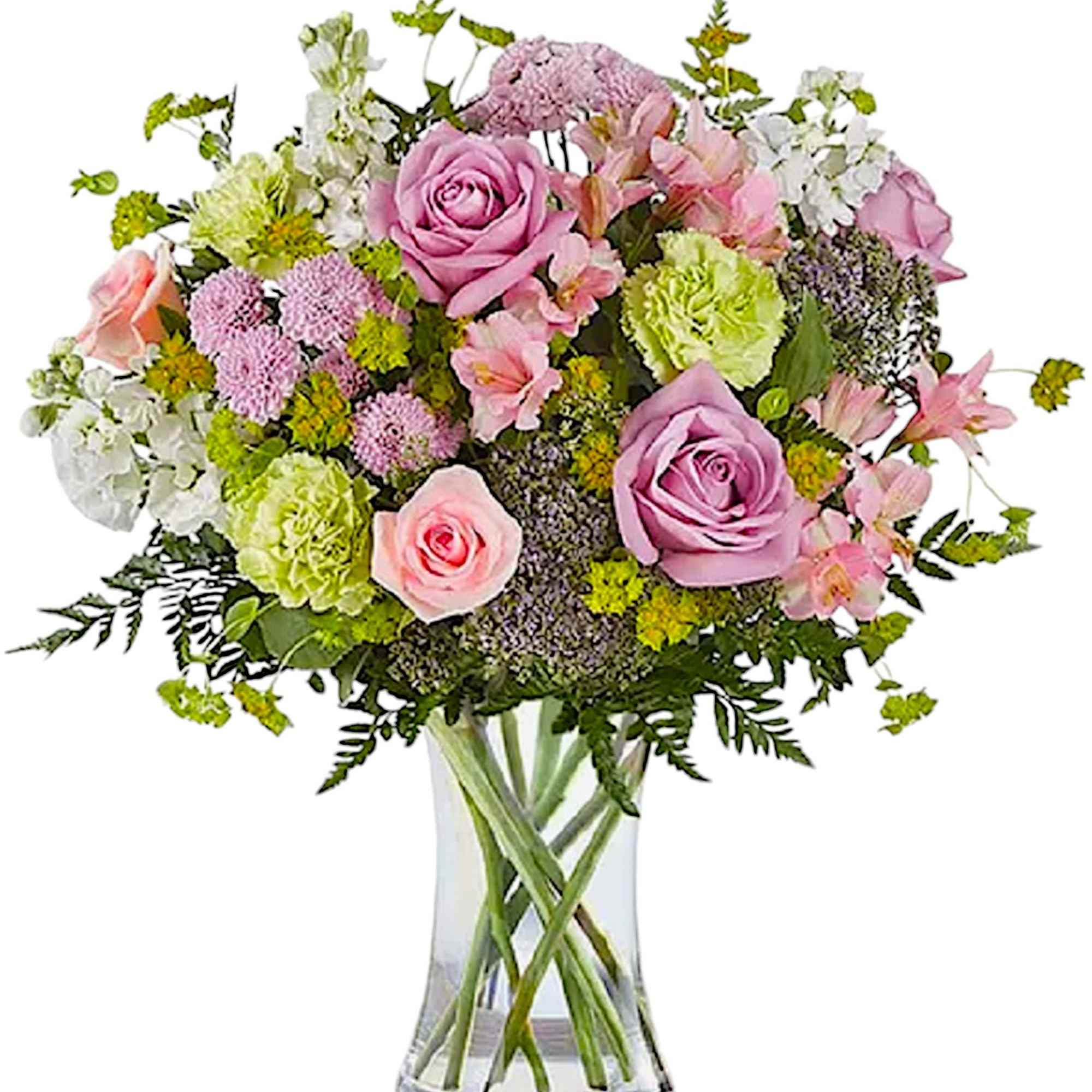 Pink and lavender mixed bouquet in a clear glass vase