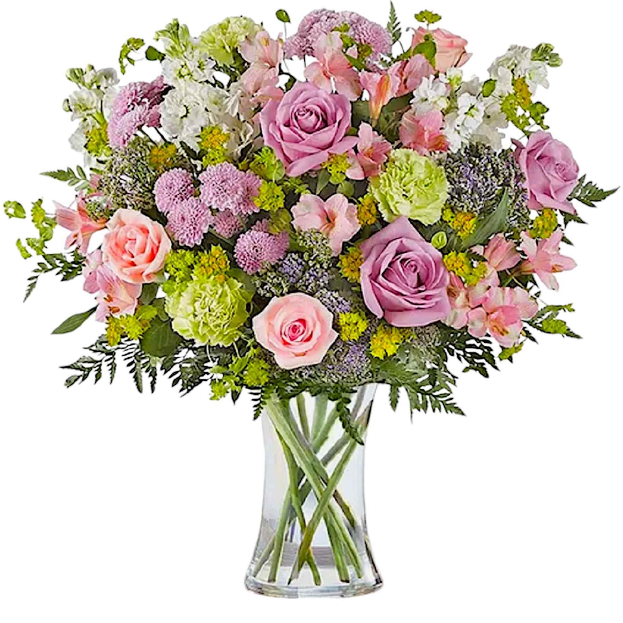 Mixed pink and white flower bouquet in a clear glass vase