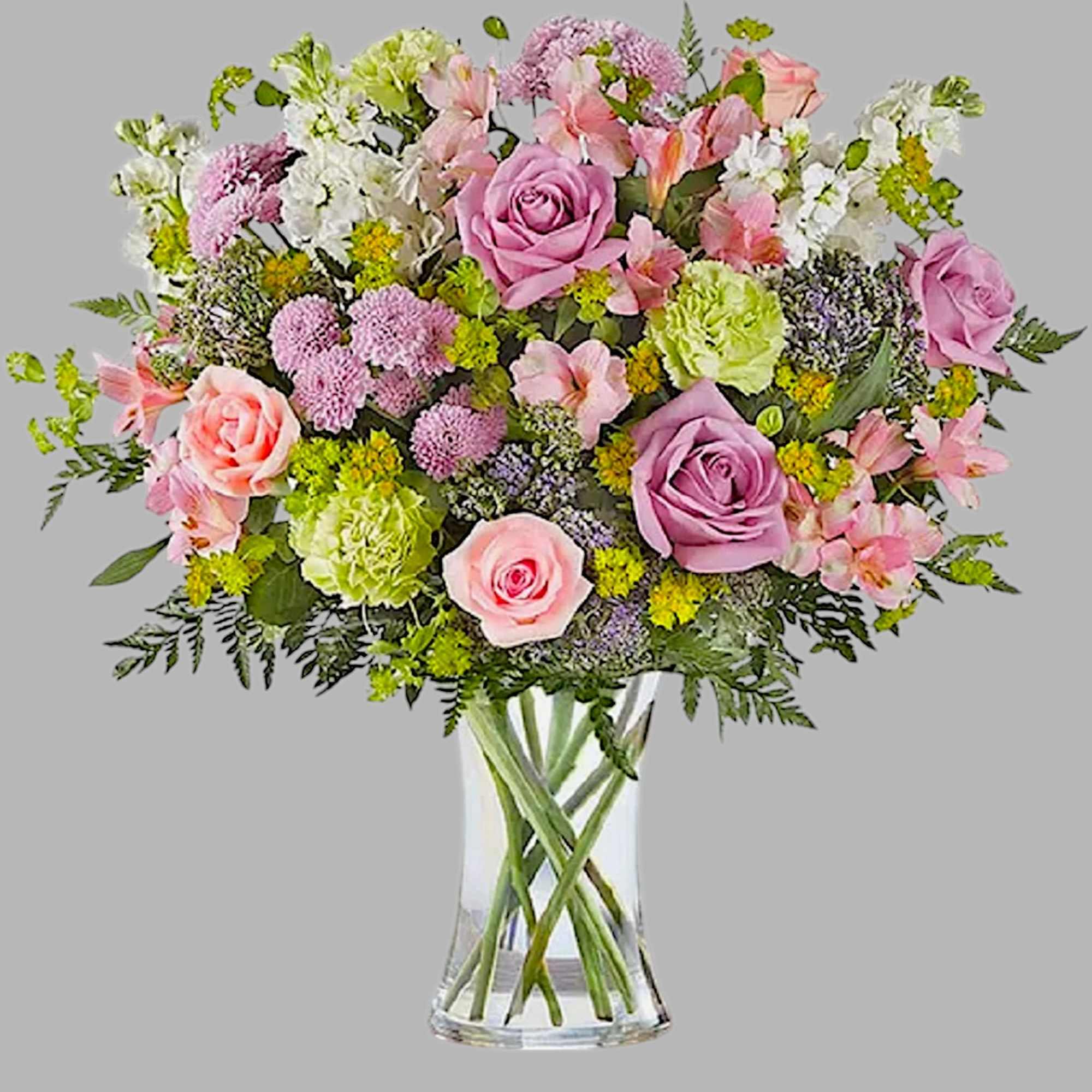 Pink and lavender mixed bouquet in a clear glass vase