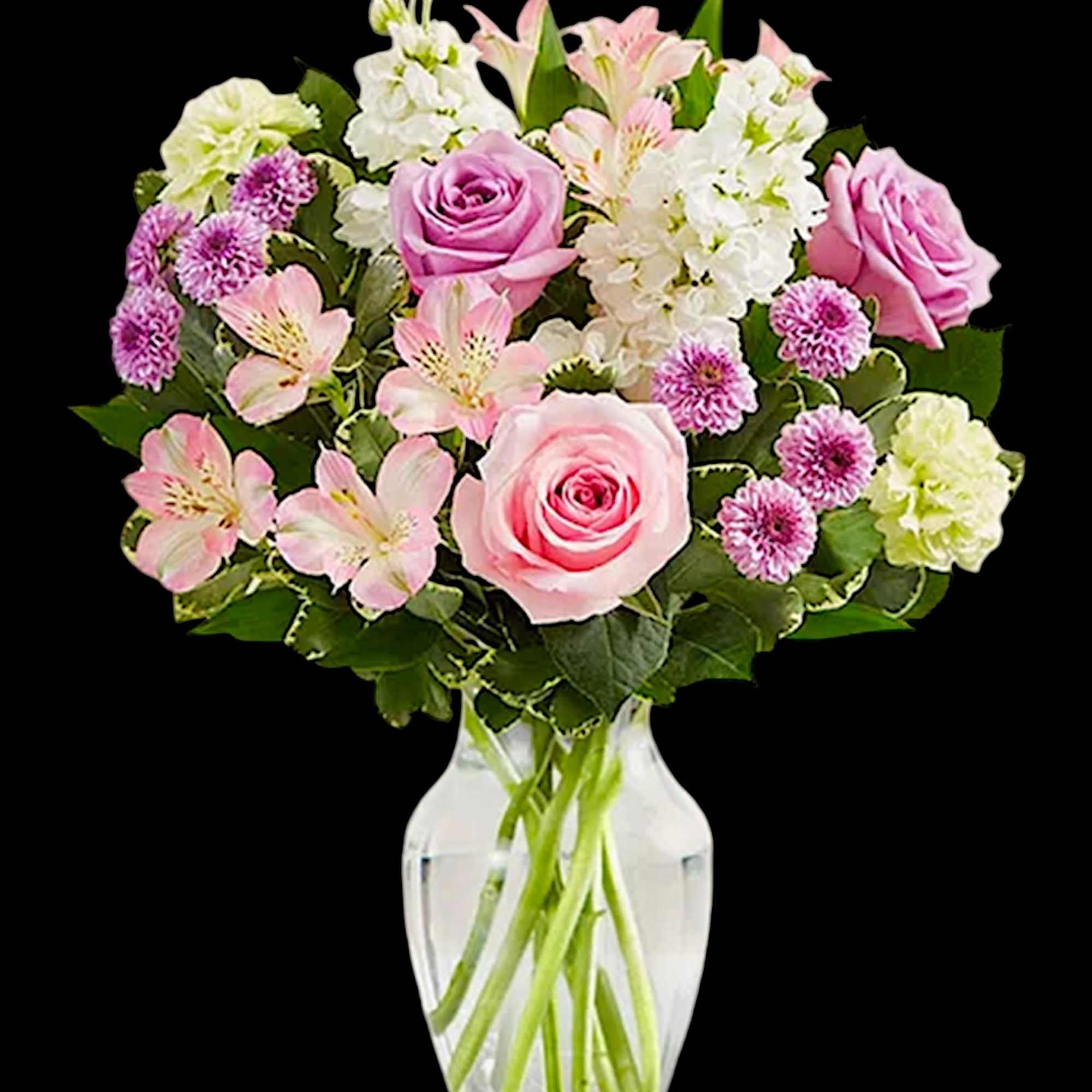 Pink and white mixed flower bouquet in a clear glass vase