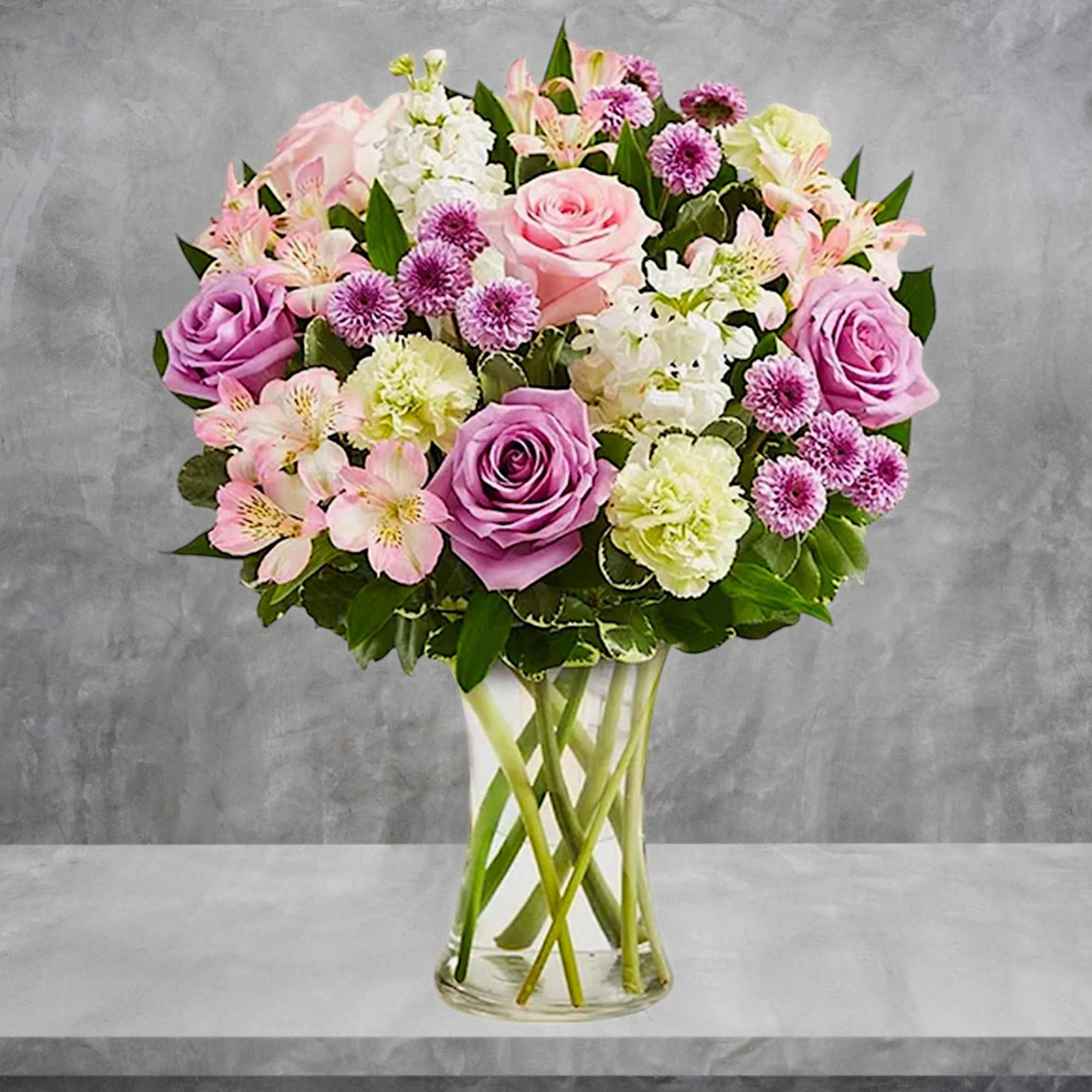 Pink and lavender bouquet in a clear glass vase, photo 4 of 6