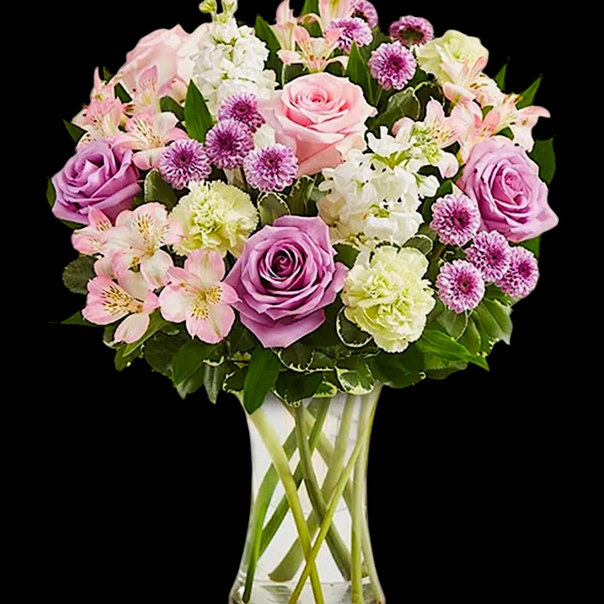 Pink and lavender roses with mixed blooms in a clear glass vase, photo 5 of 6