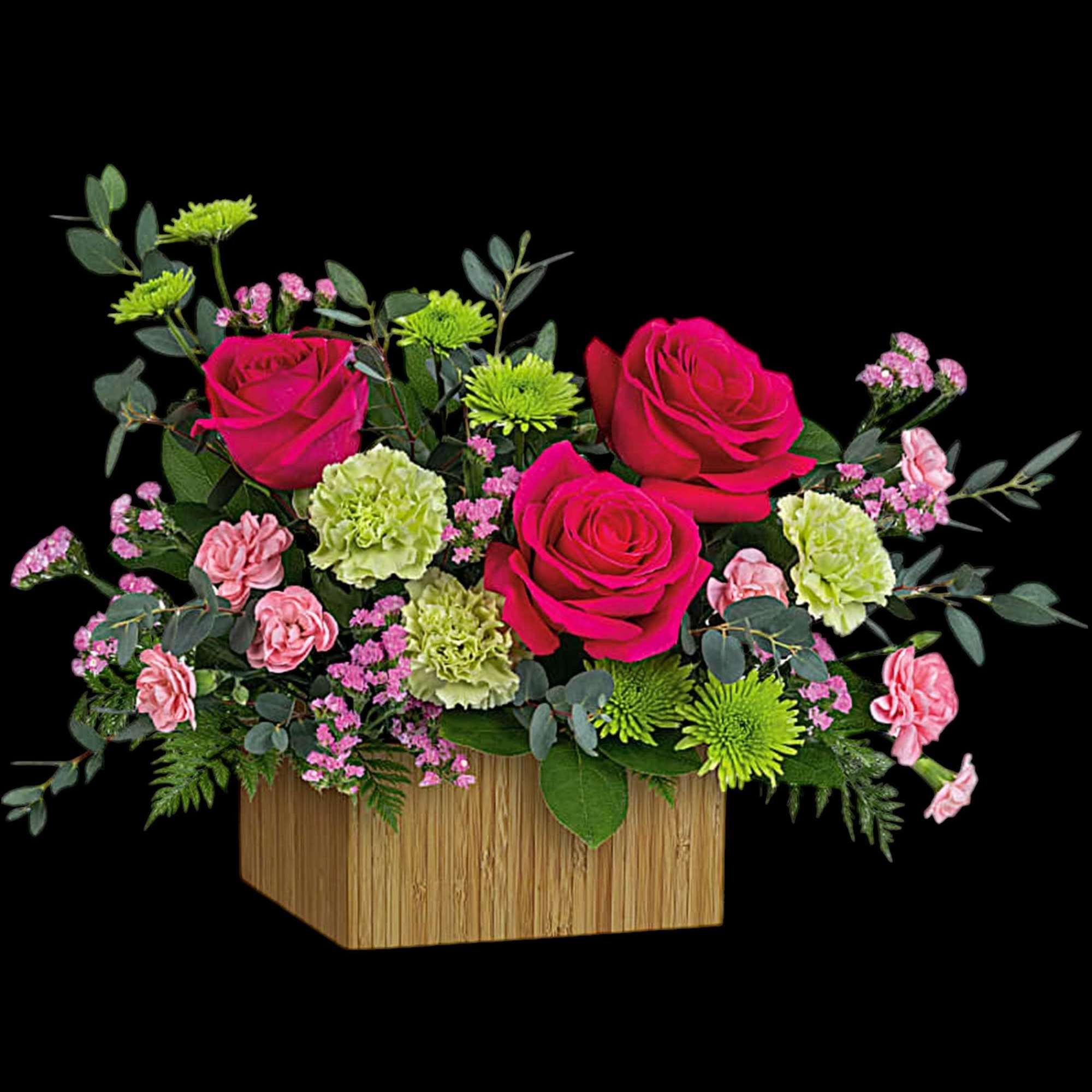 Pink roses and carnations in a wooden box arrangement