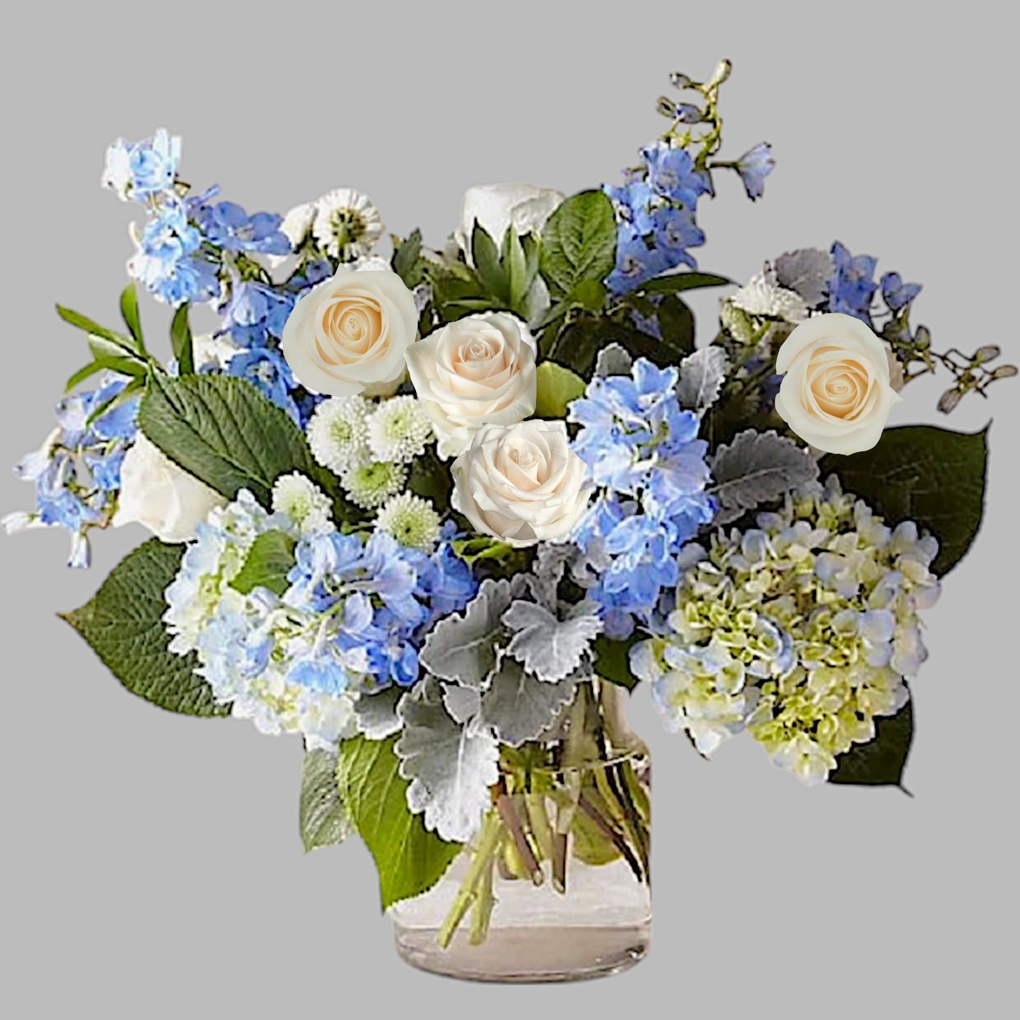 Blue and white flower arrangement in a clear glass vase, photo 6 of 7