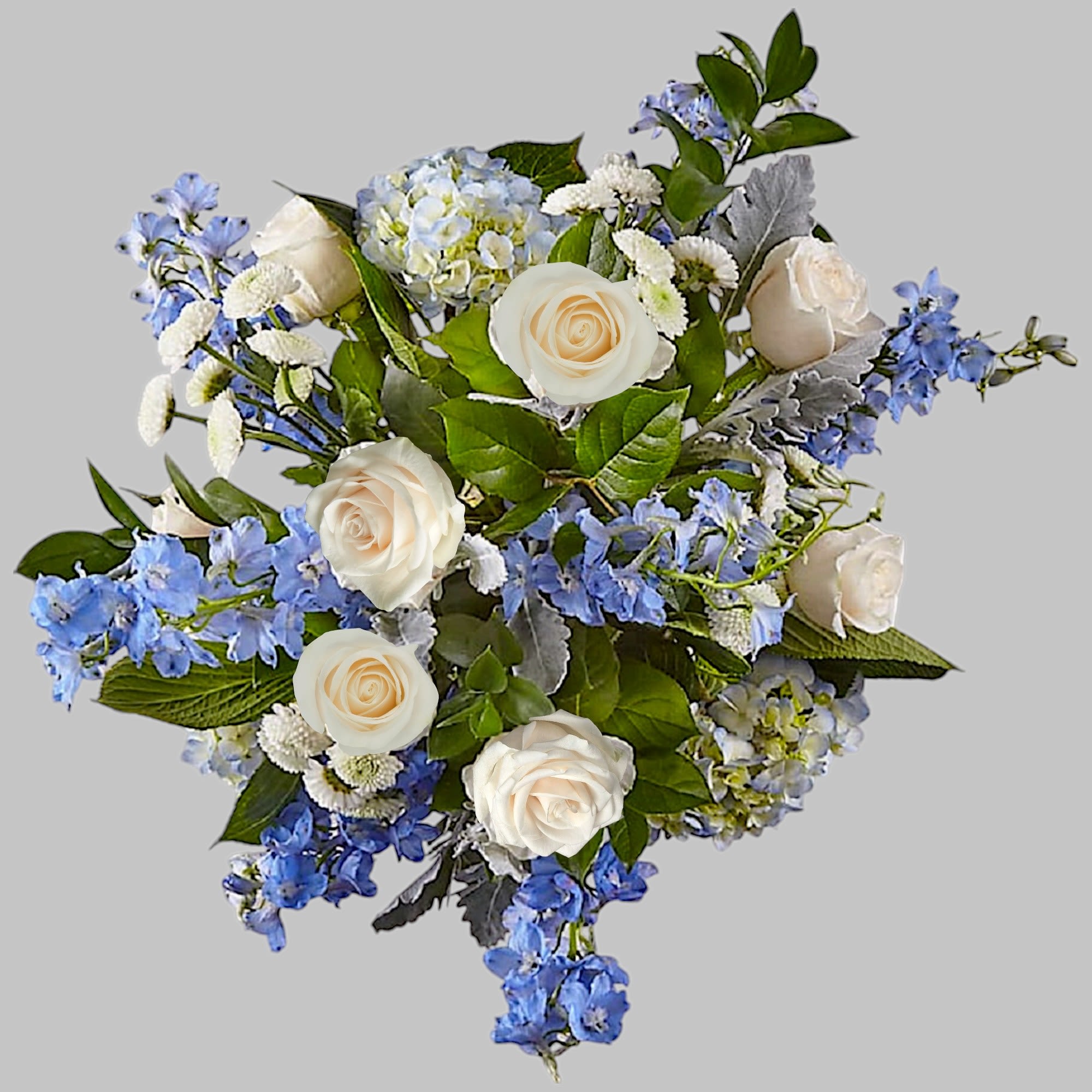 Bouquet of white roses and blue flowers with green foliage