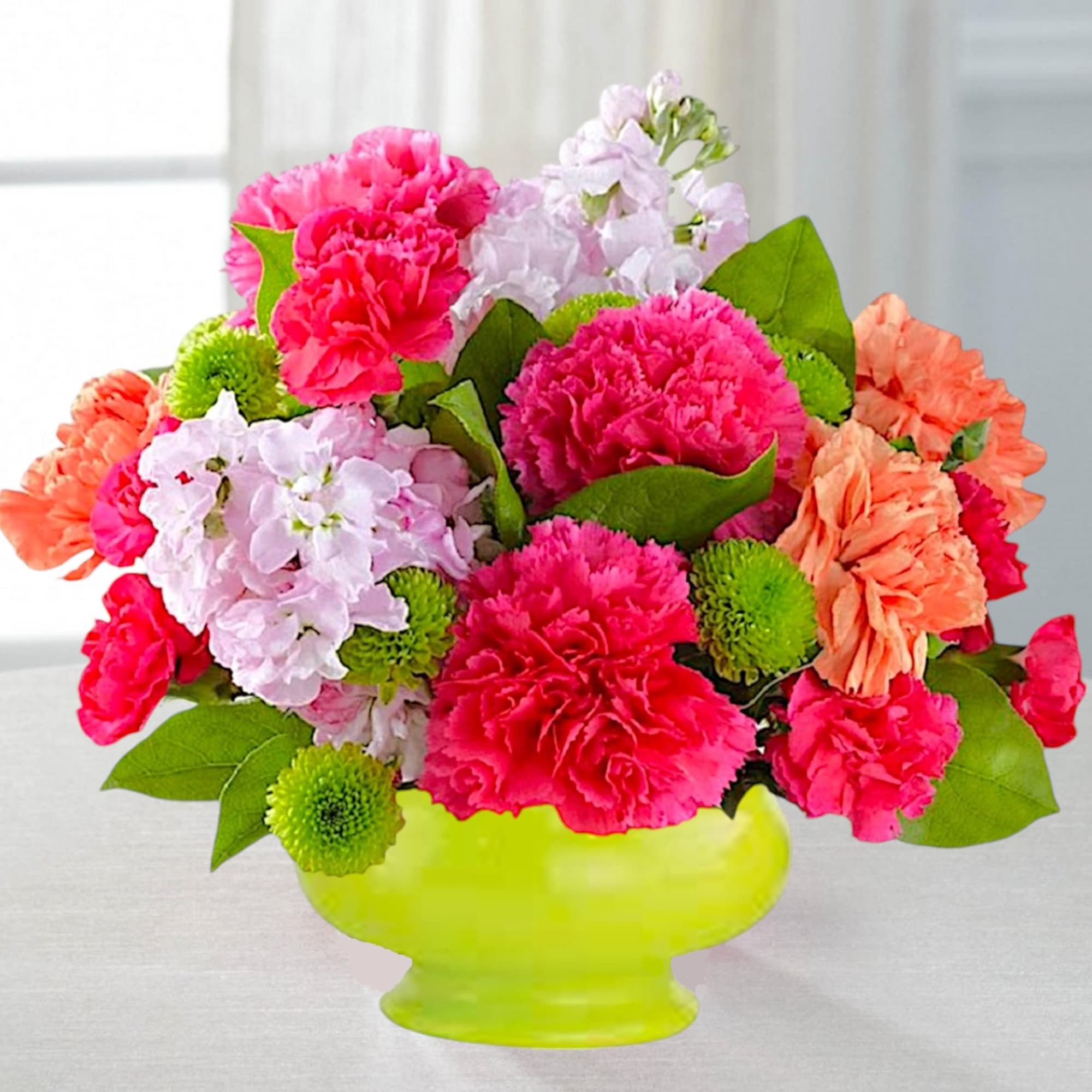 Bright mixed bouquet in a lime green vase with pink and peach flowers, photo 2 of 5