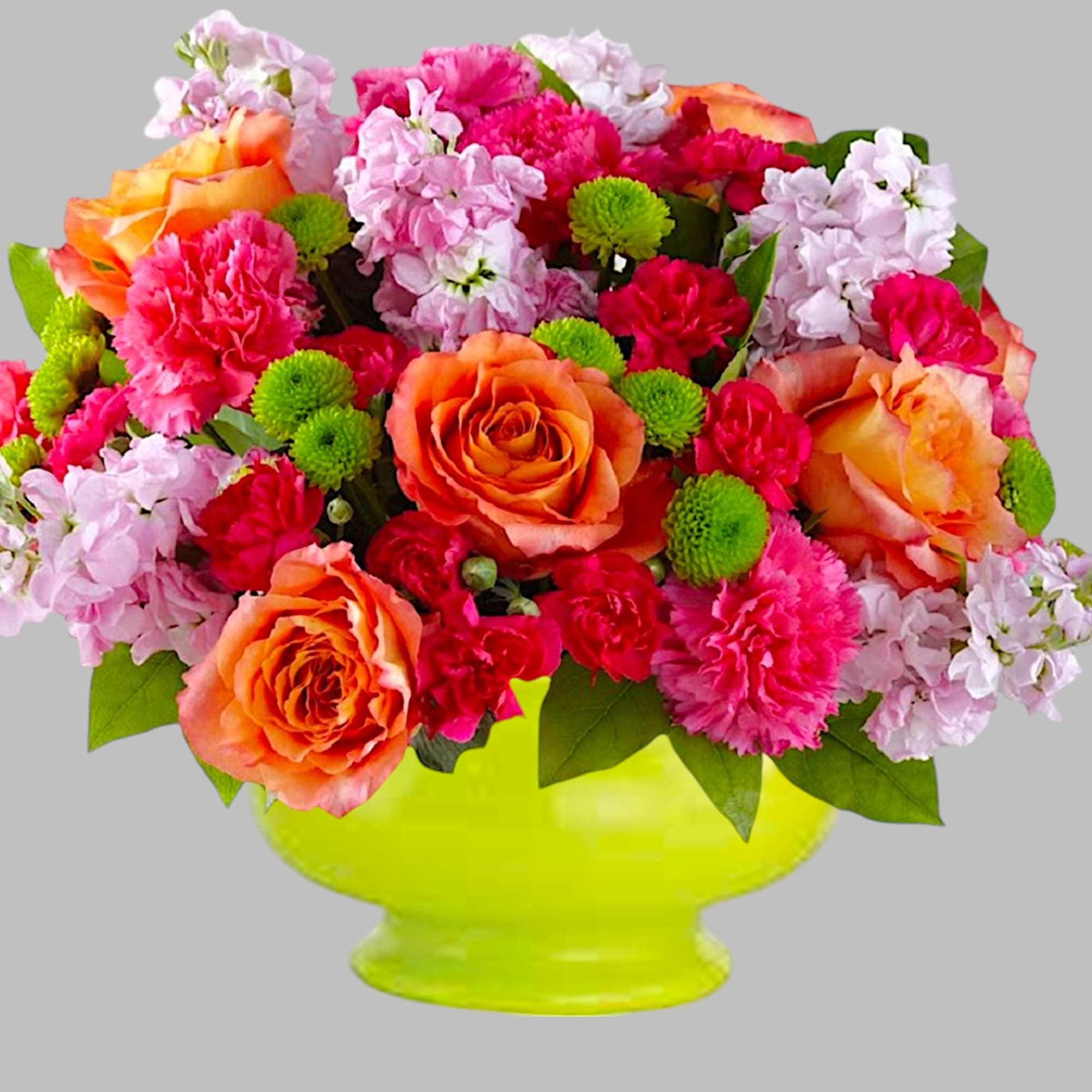Mixed bouquet of orange roses, pink carnations, and green button mums in a lime vase