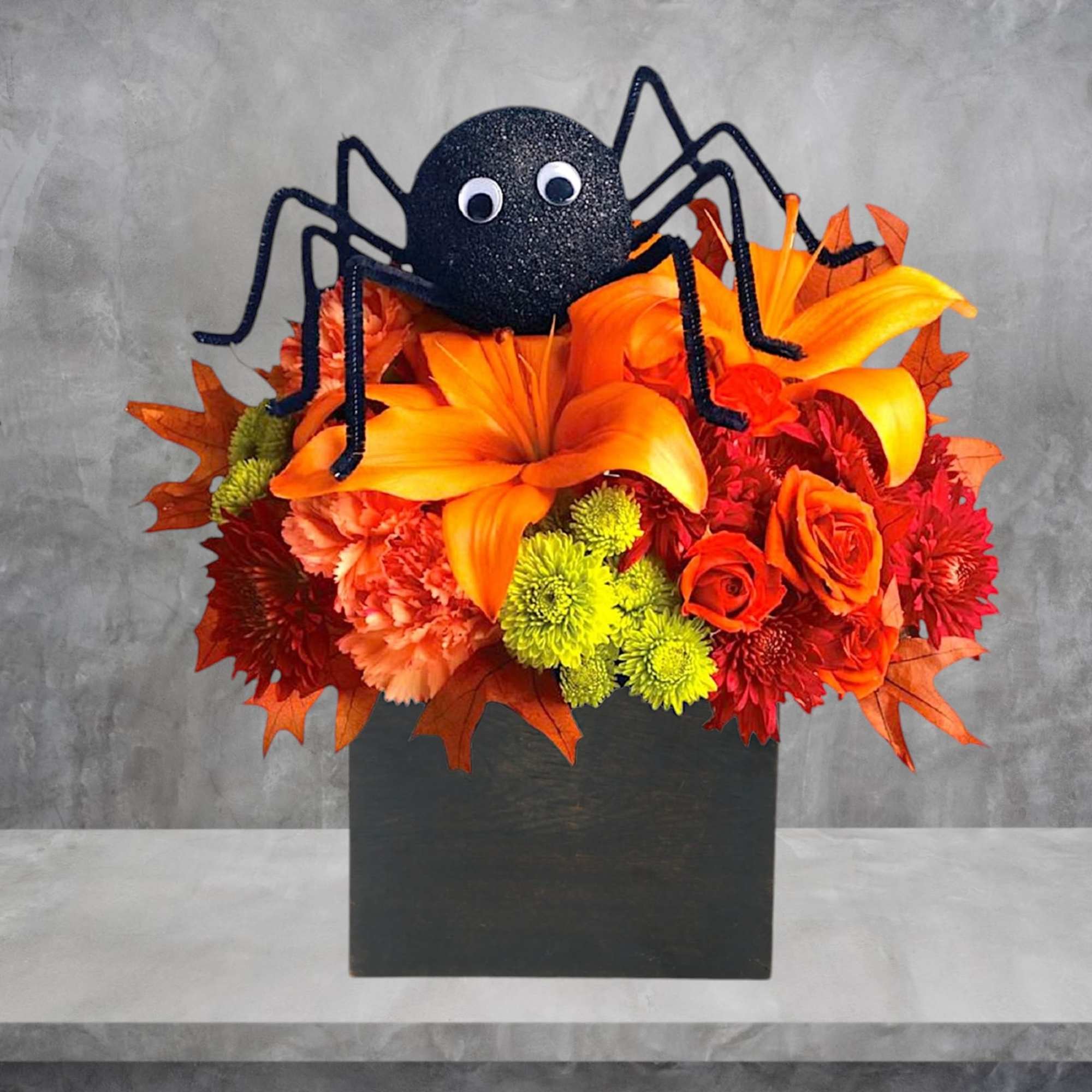 Halloween bouquet with a spider topper in a black box