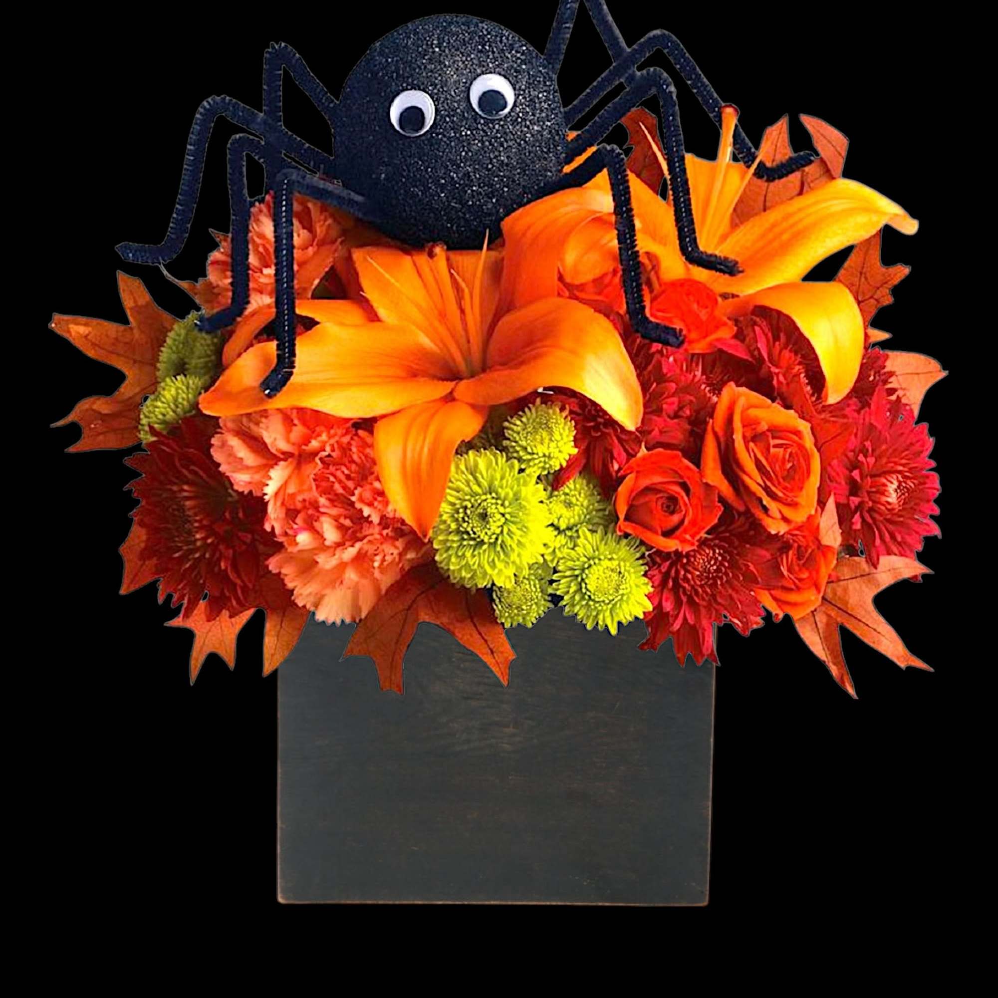 Halloween floral arrangement with a black spider decoration in a square vase