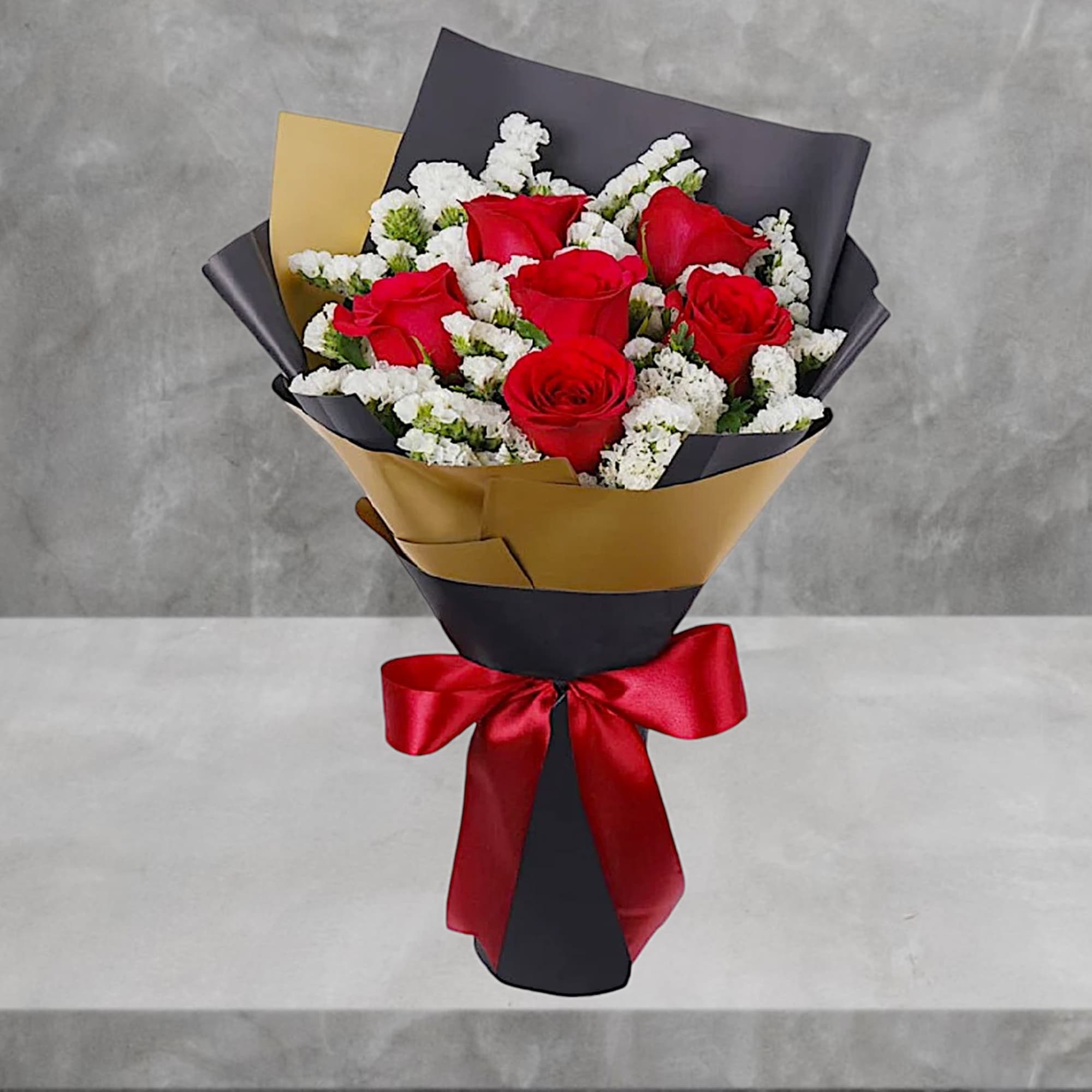 Bouquet of red roses with white filler flowers wrapped in black and gold paper, photo 2 of 5