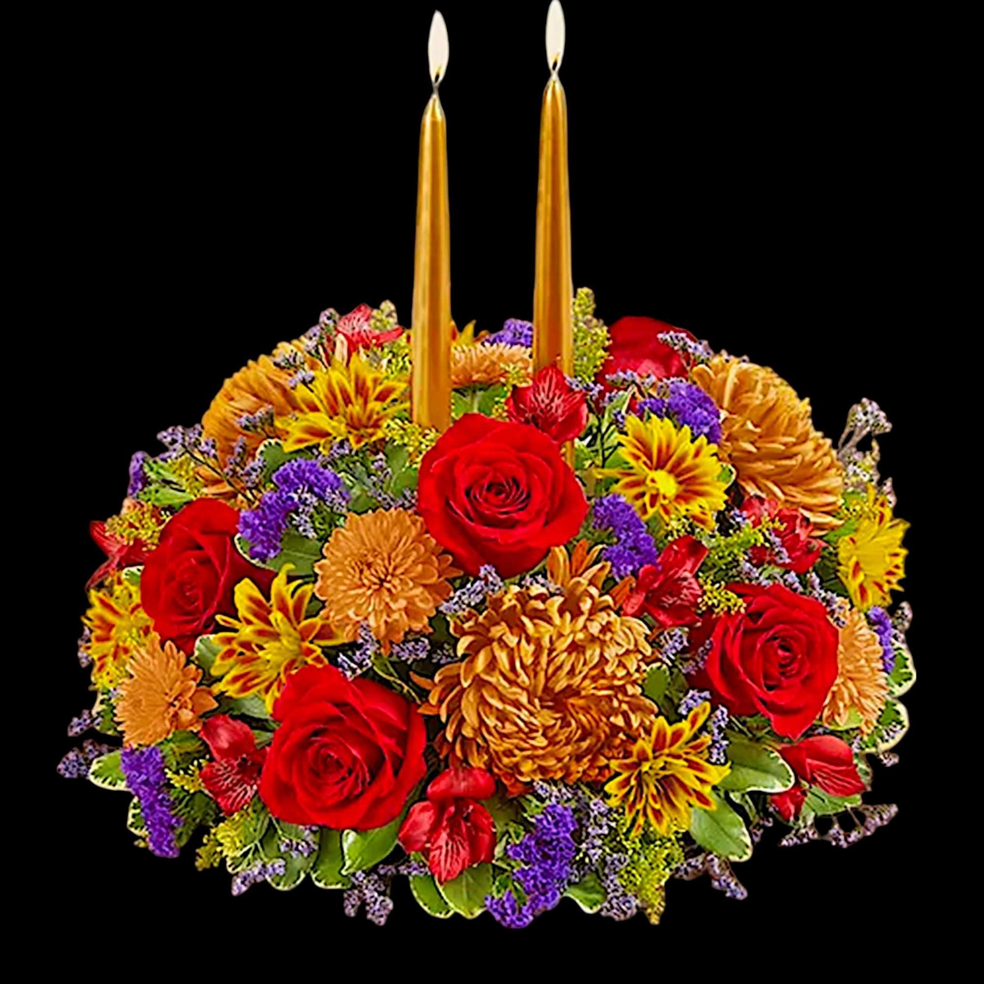 Floral centerpiece with two gold taper candles