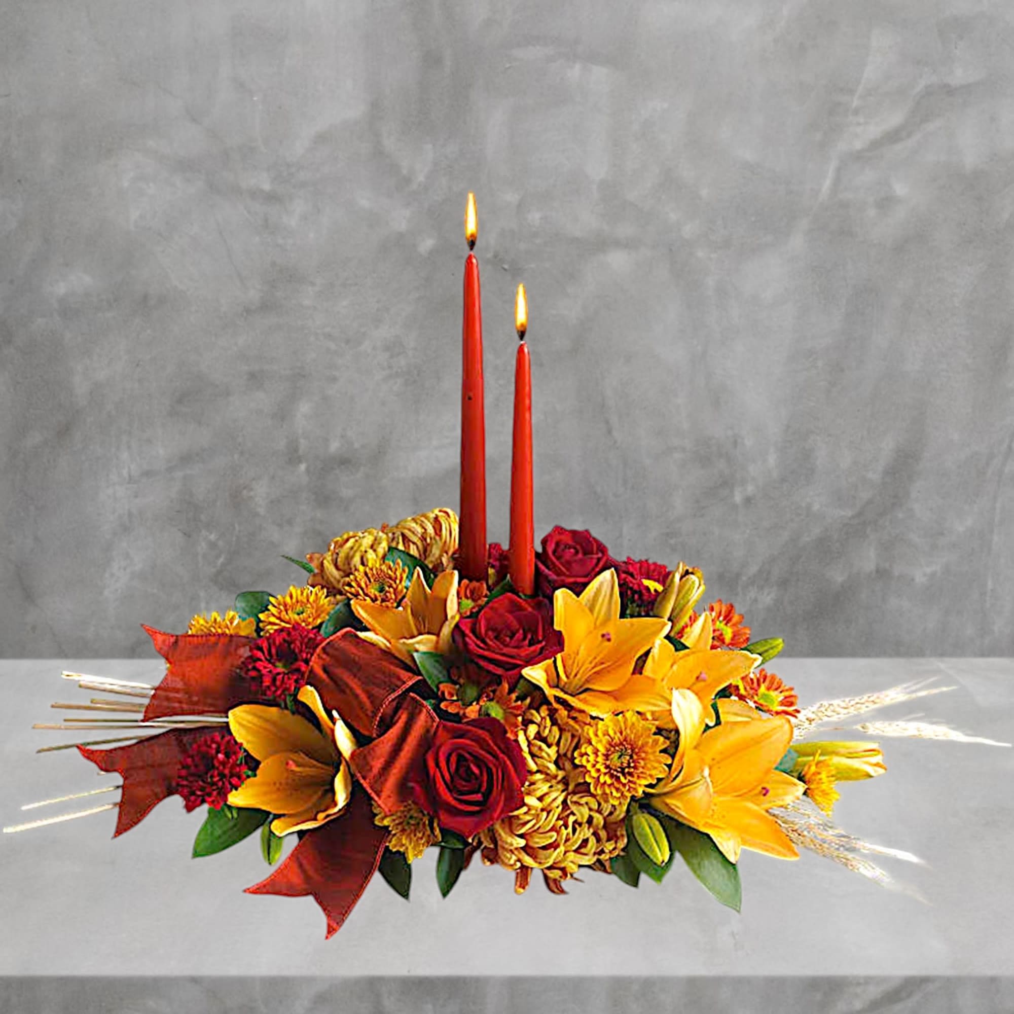 Autumn floral centerpiece with two red candles
