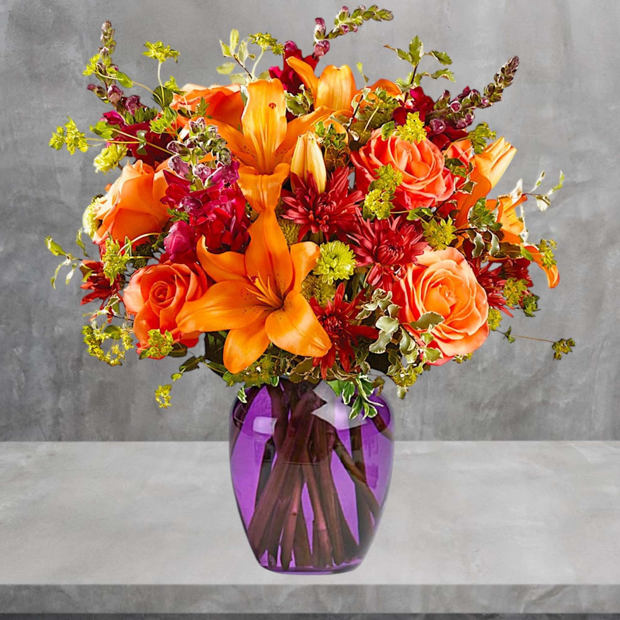 Orange lilies and roses in a purple glass vase, photo 2 of 3