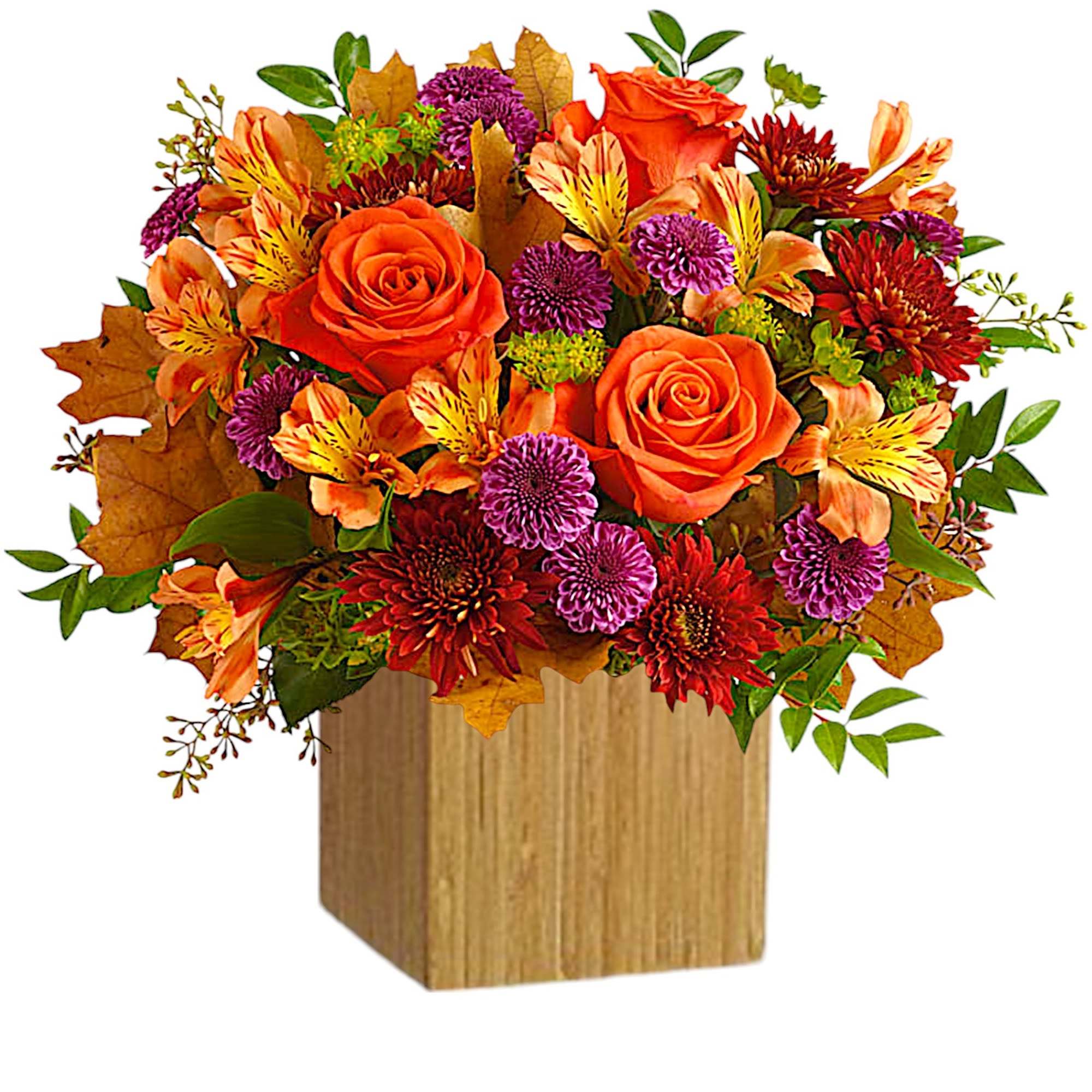 Orange roses and mixed fall flowers in a wooden cube vase