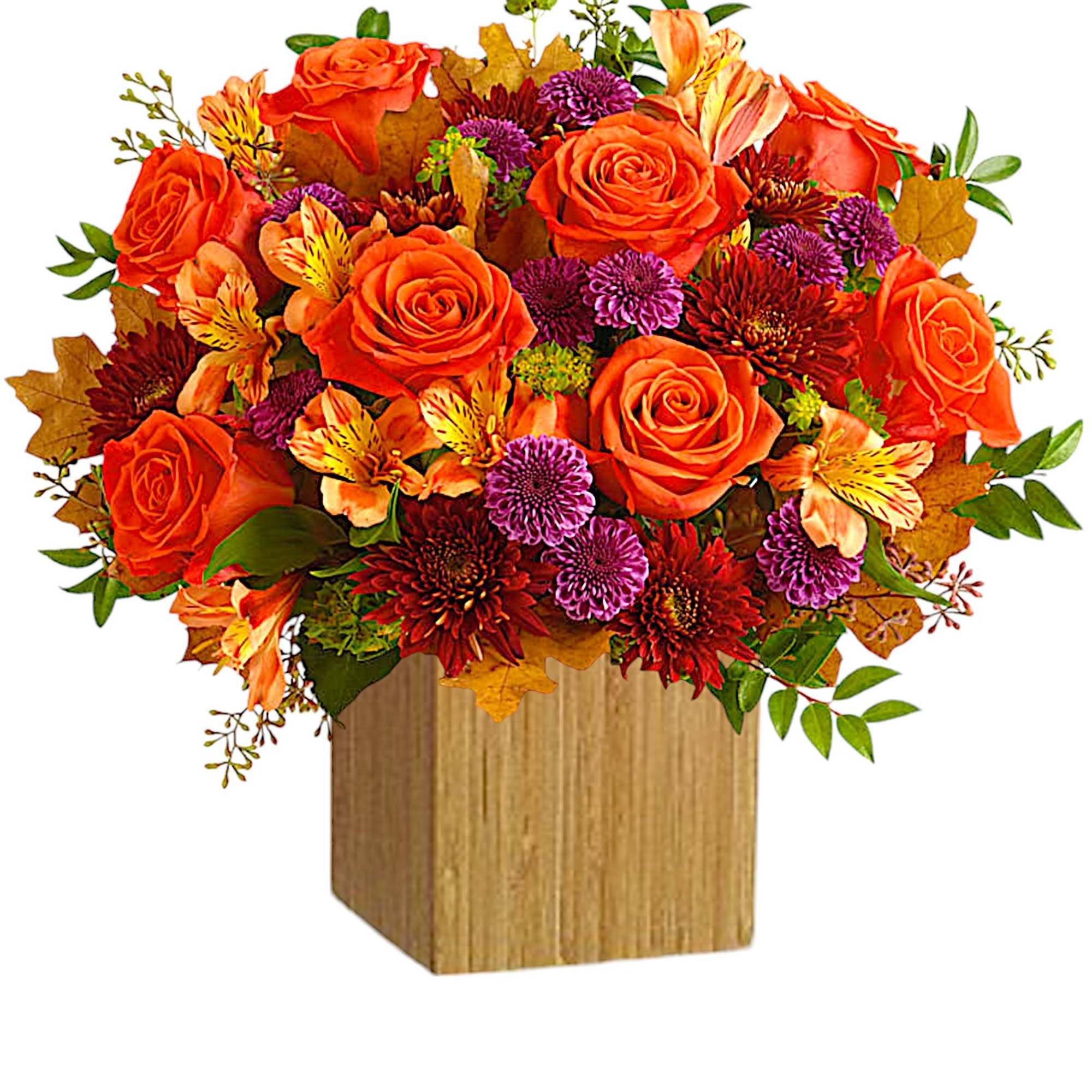 Orange roses and mixed fall flowers in a wooden cube vase