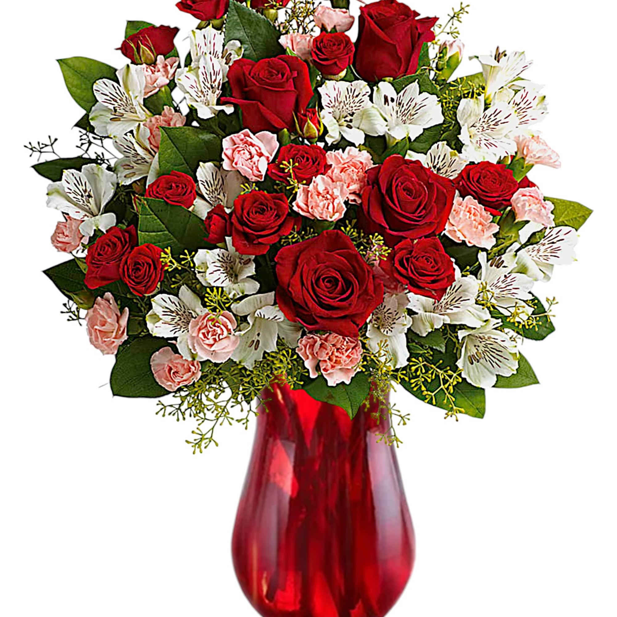 Red roses and pink alstroemeria in a red glass vase