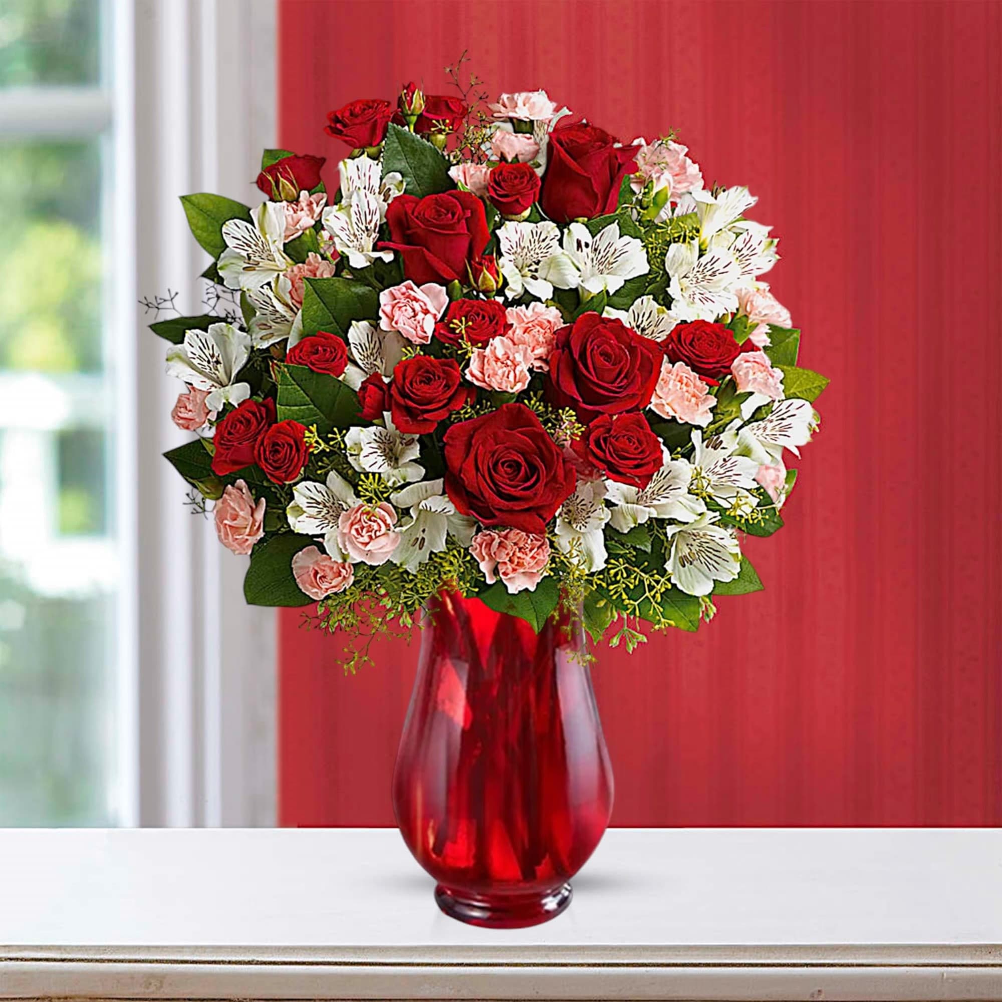 Red roses and white alstroemeria in a red glass vase, photo 2 of 3