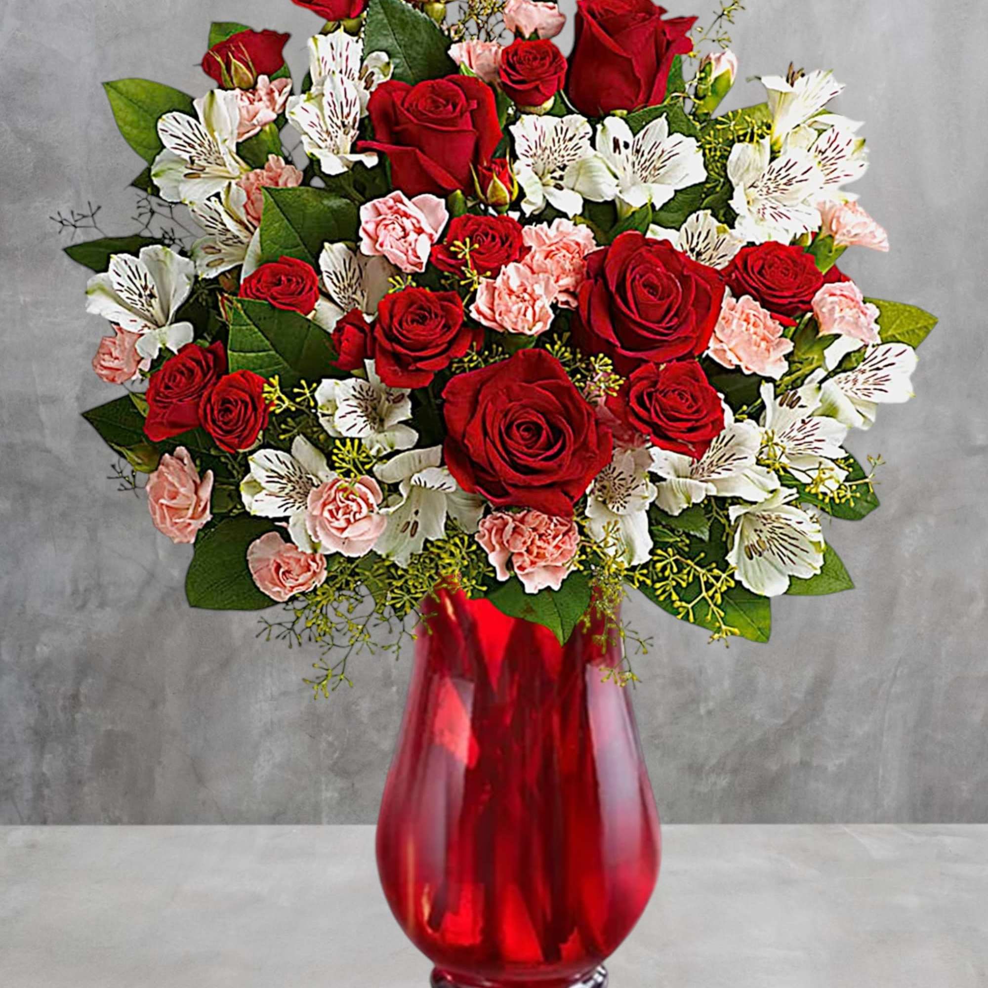 Red roses and white alstroemeria in a red glass vase, photo 3 of 3