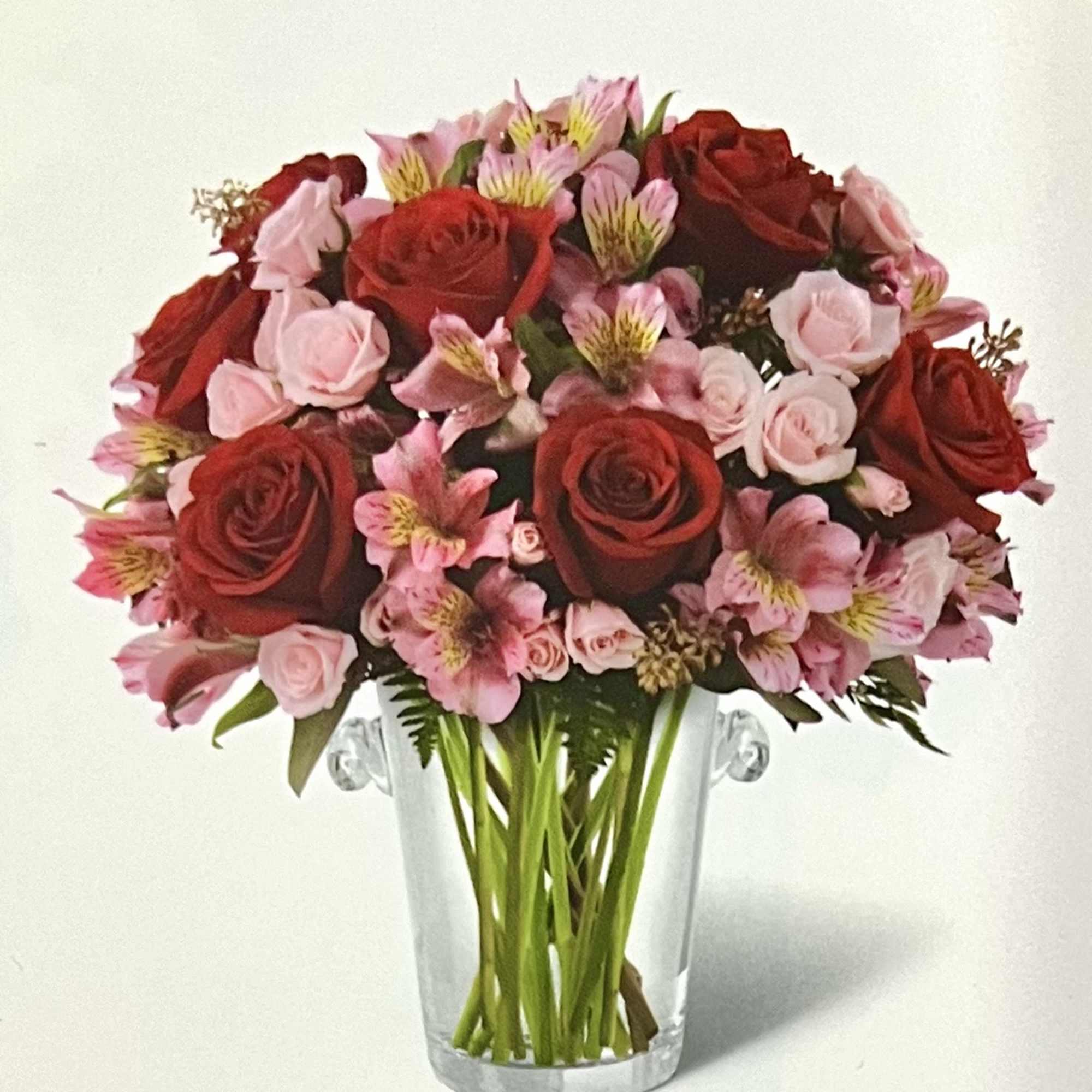 Bouquet of red and pink roses in a clear glass vase, photo 2 of 2