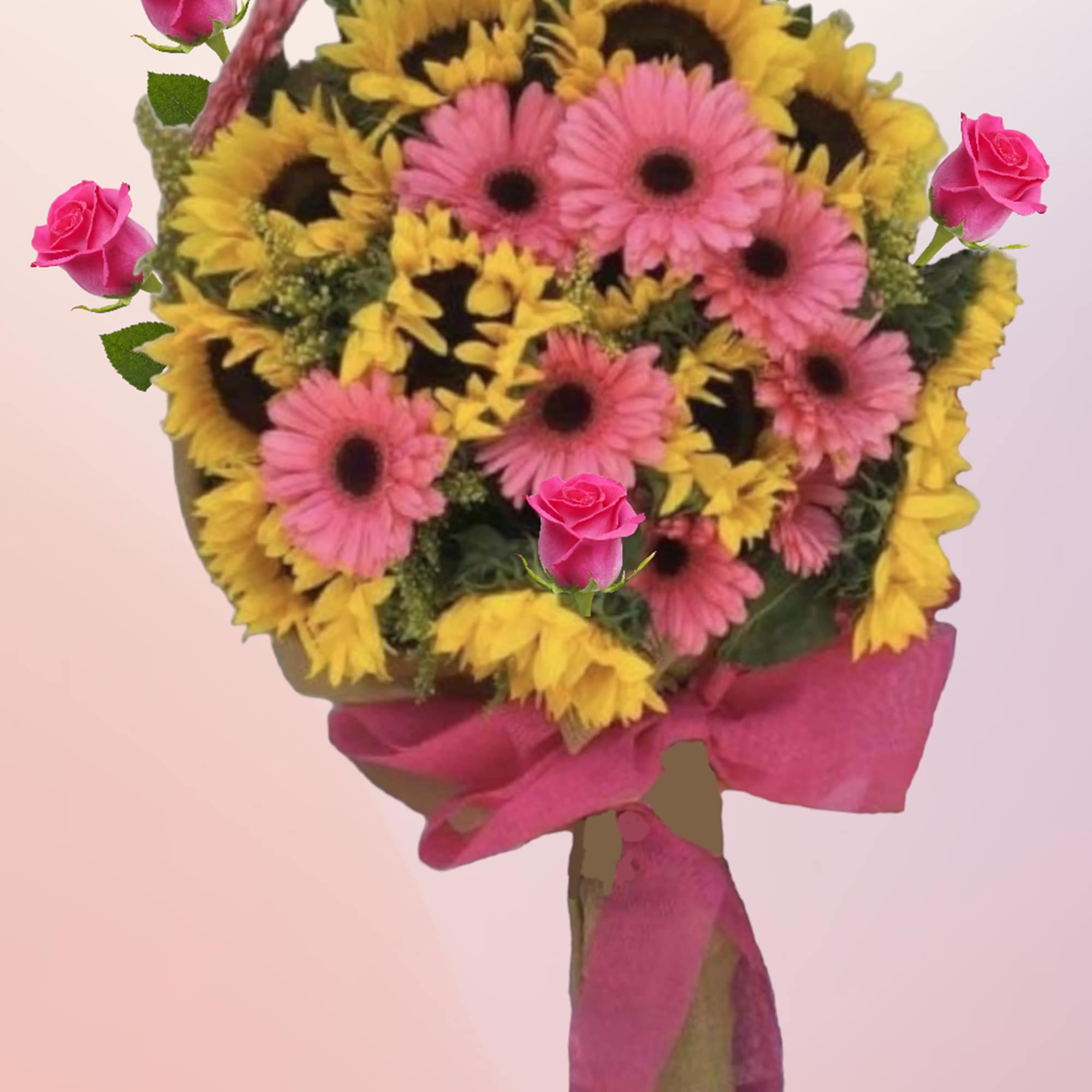 Bouquet of pink roses, pink gerbera daisies, and yellow sunflowers with a pink ribbon