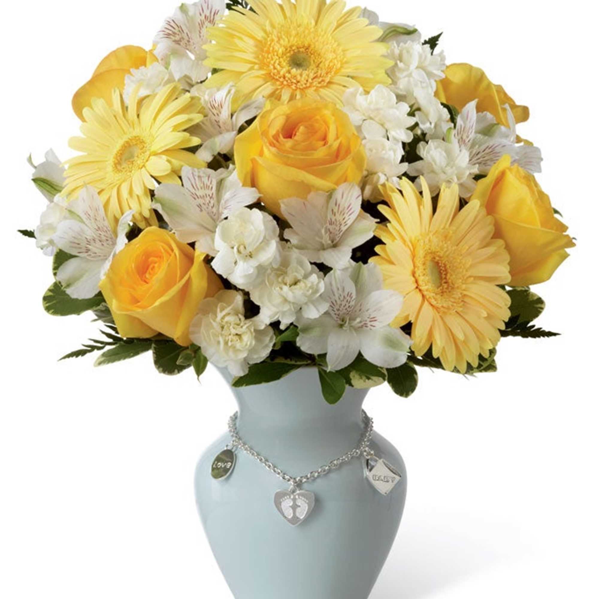 Yellow roses and daisies arranged in a light blue vase