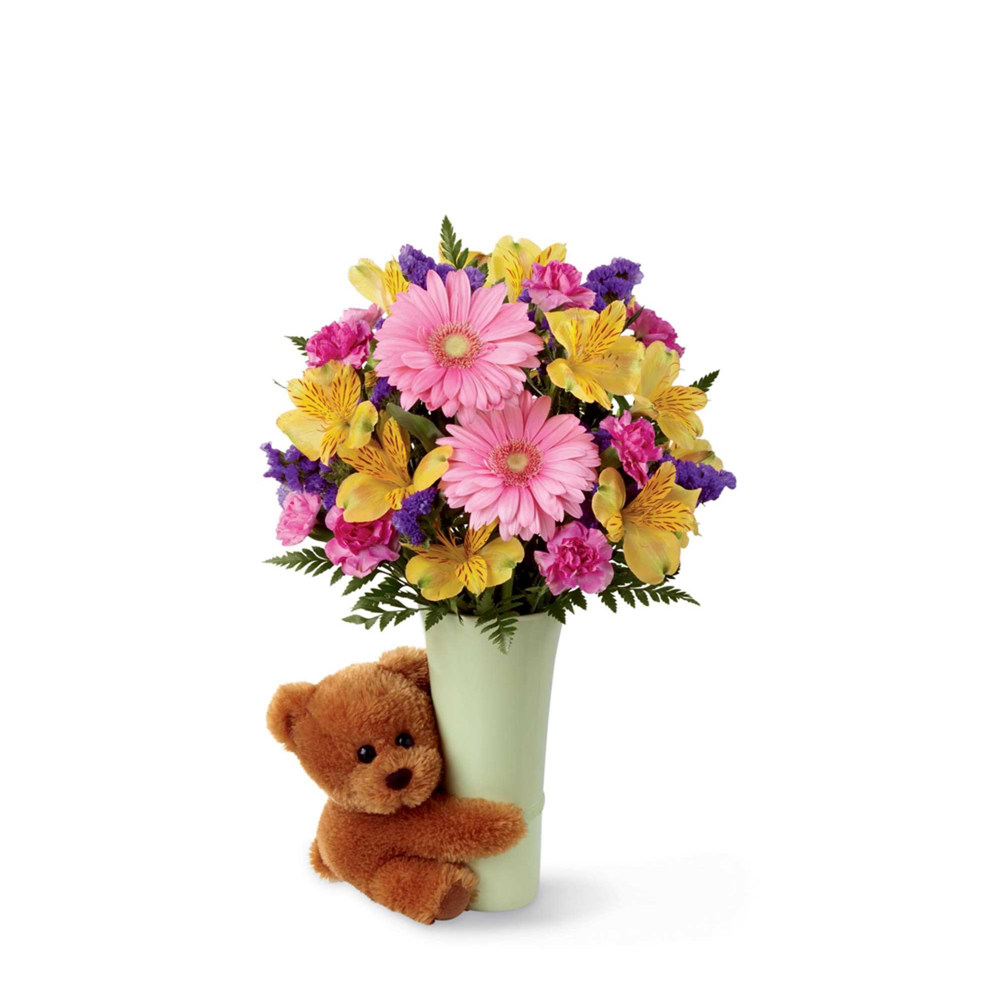 Pink and yellow mixed bouquet in a vase with a teddy bear
