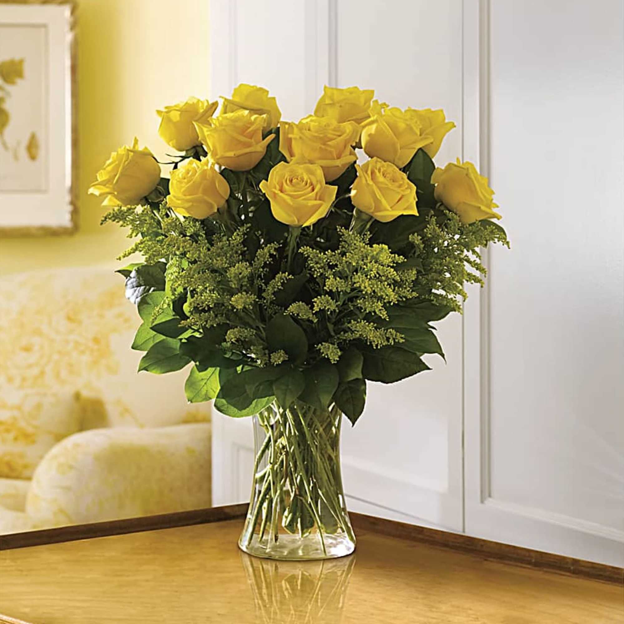 Bouquet of yellow roses in a clear glass vase