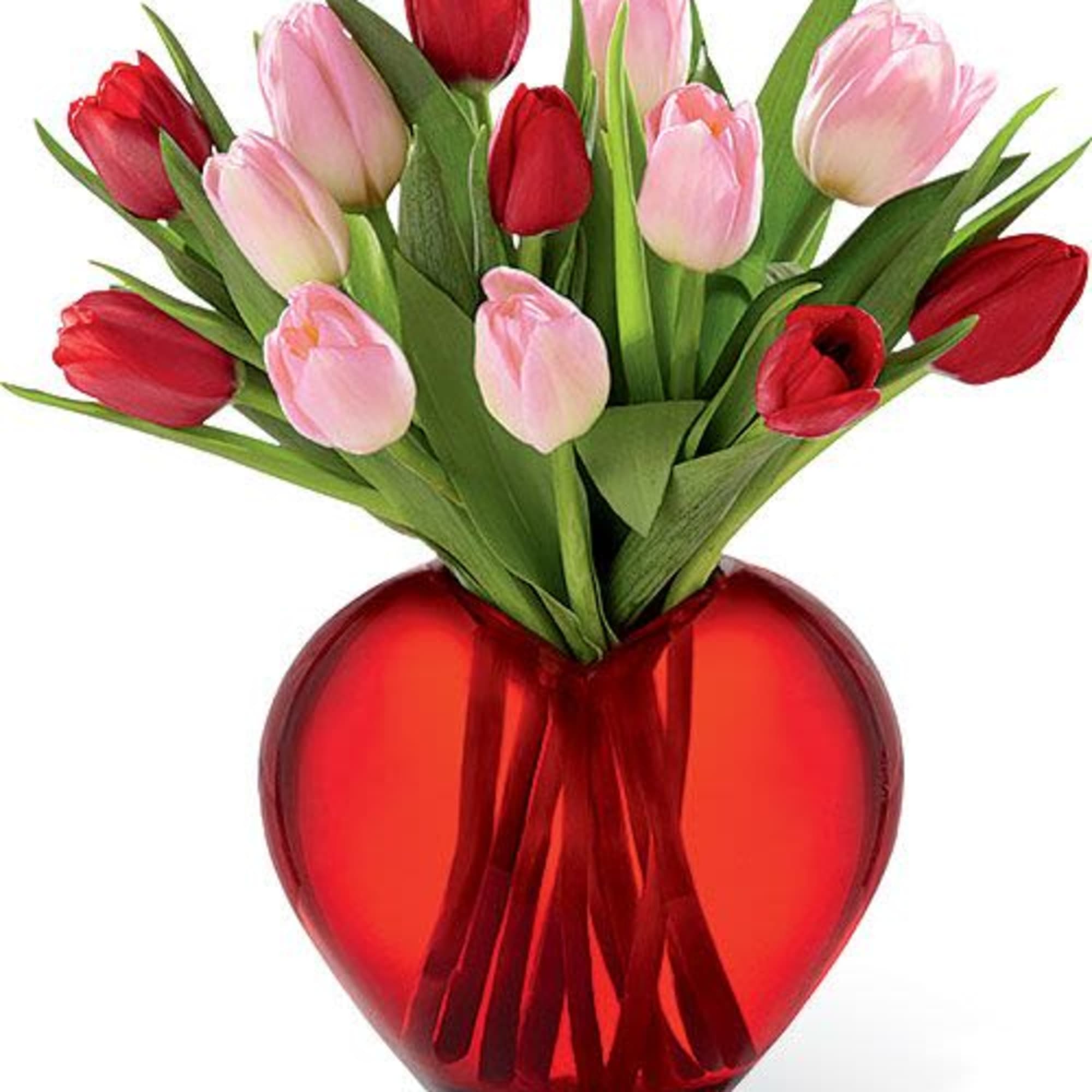 Red and pink tulips in a red heart-shaped vase