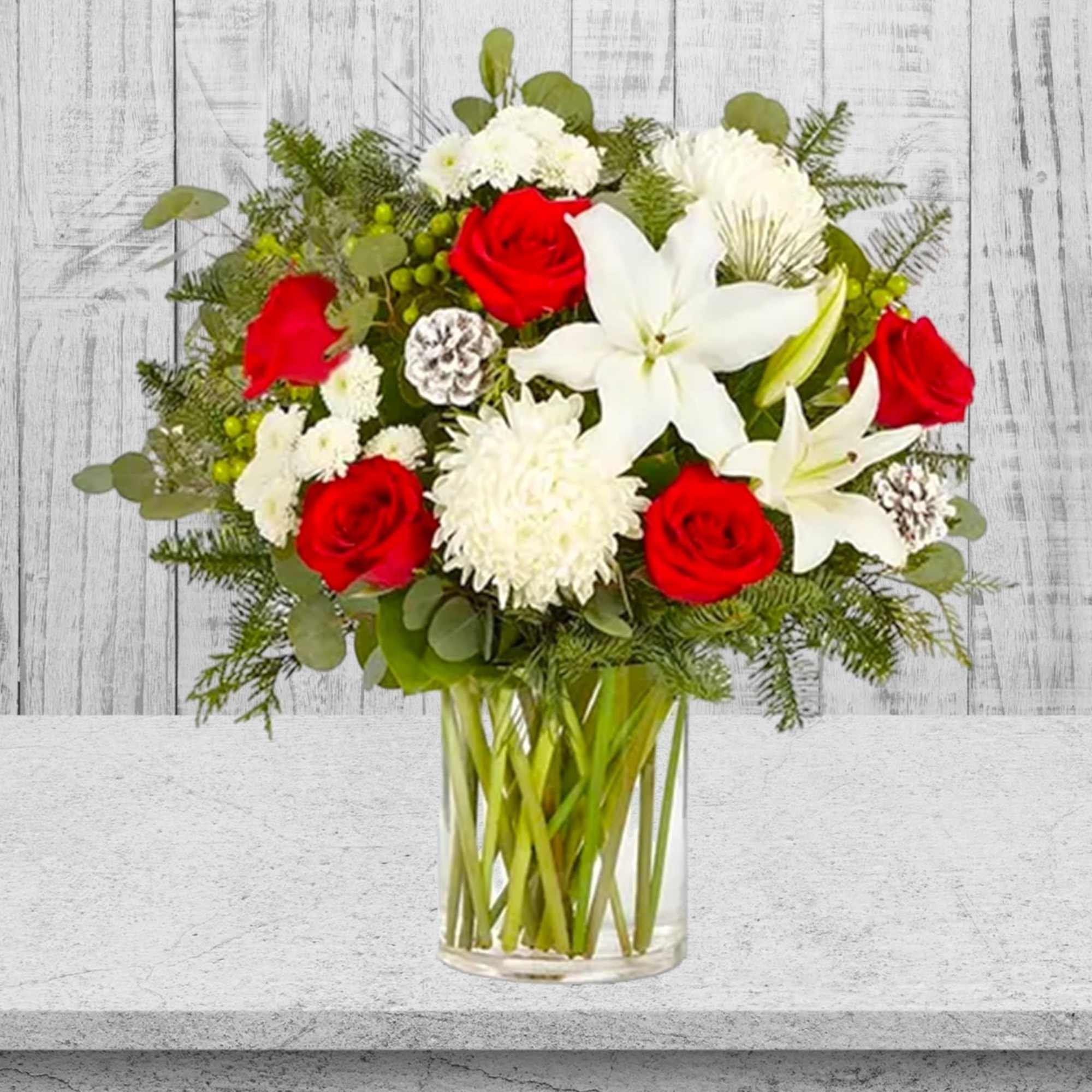Red roses and white lilies in a clear glass vase, photo 2 of 4