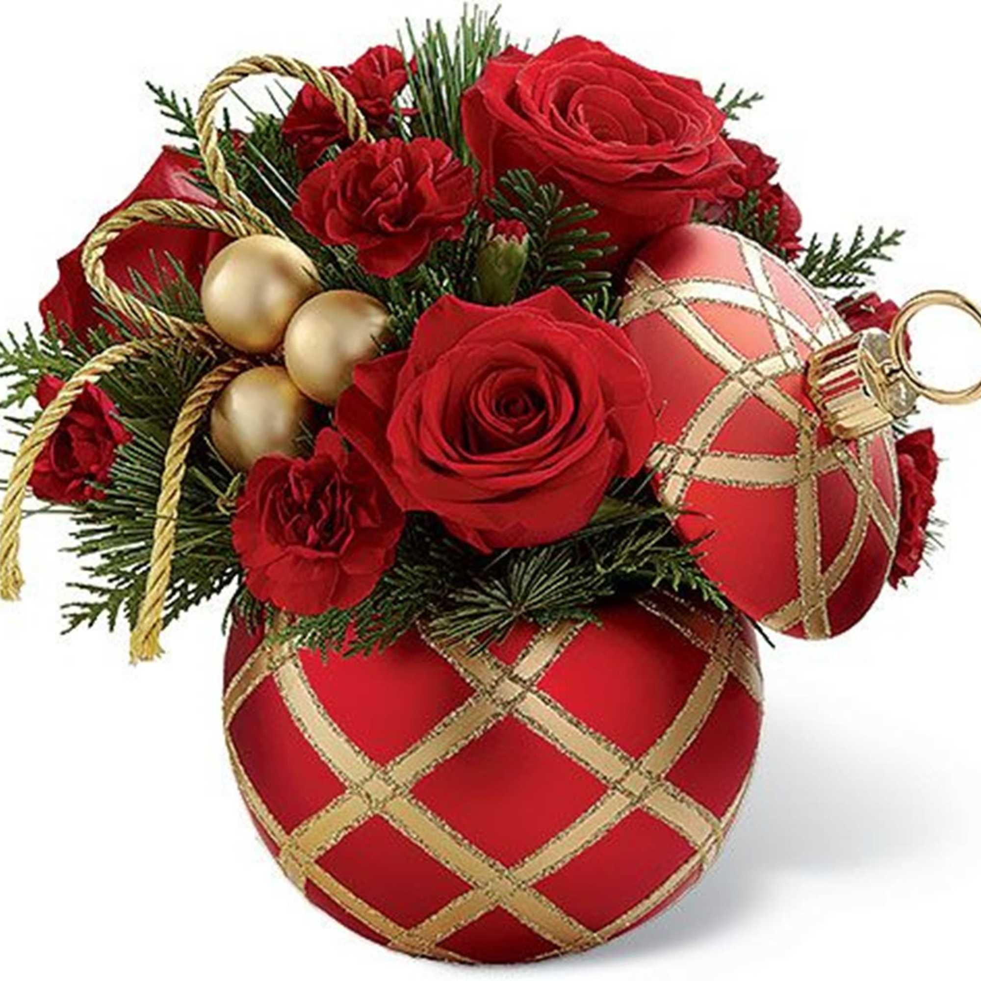 Red roses arranged with gold ornaments in a decorative container