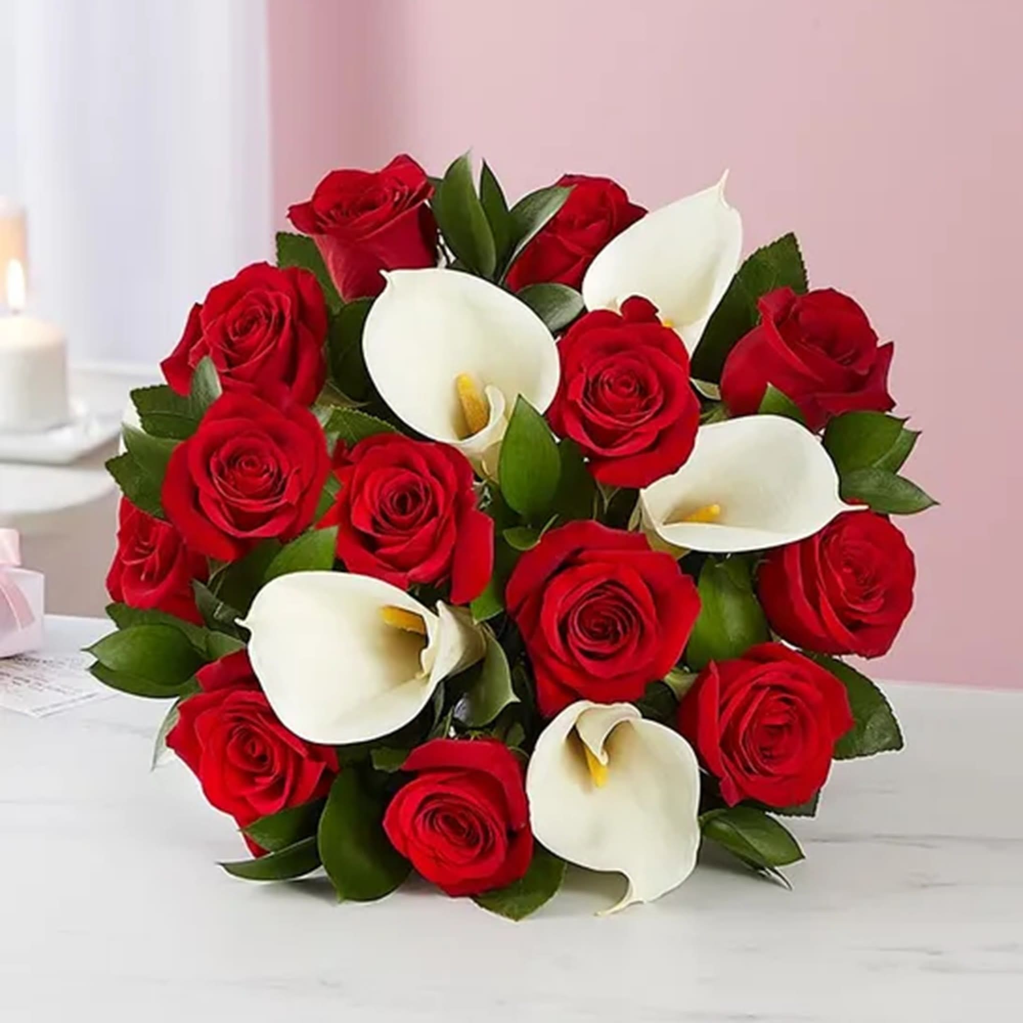 Bouquet of red roses and white calla lilies